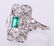 A Platinum, Diamond and Emerald Ring