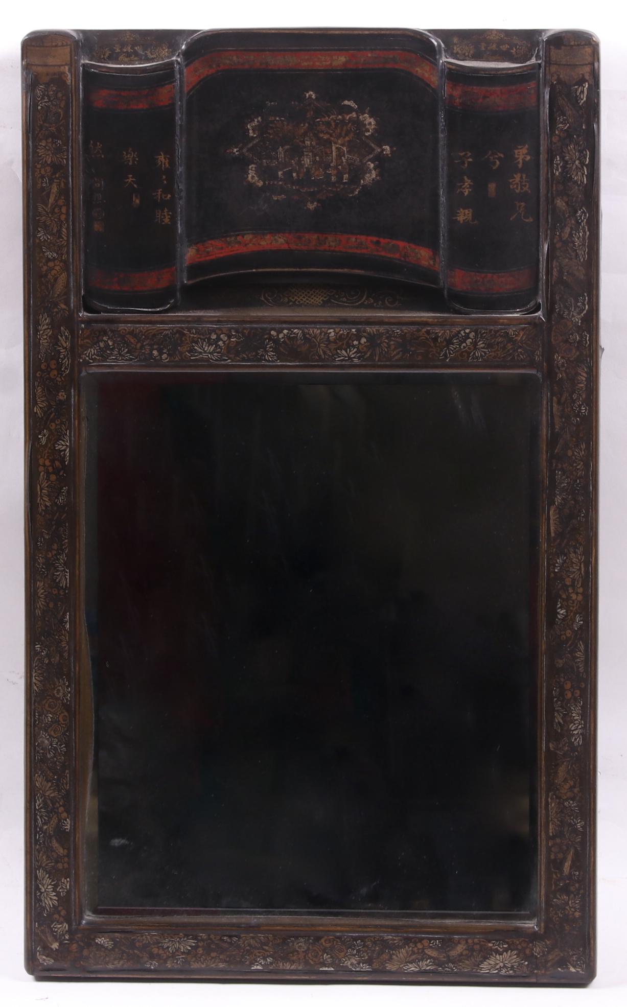 A Chinese Leather Covered Mirror: 20th century, with a black ground and hand painted decoration. Dimensions: 29" x 17". Provenance: From a local estate.