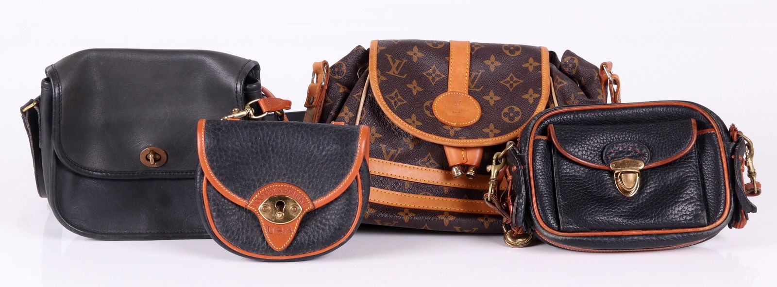 A Group of Designer Purses: All leather, Dooney and Bourke, Coach and Louis Vuitton. All guaranteed authentic. Dimensions: From 6" x 5" x 2" to 10" x 9" x 4".