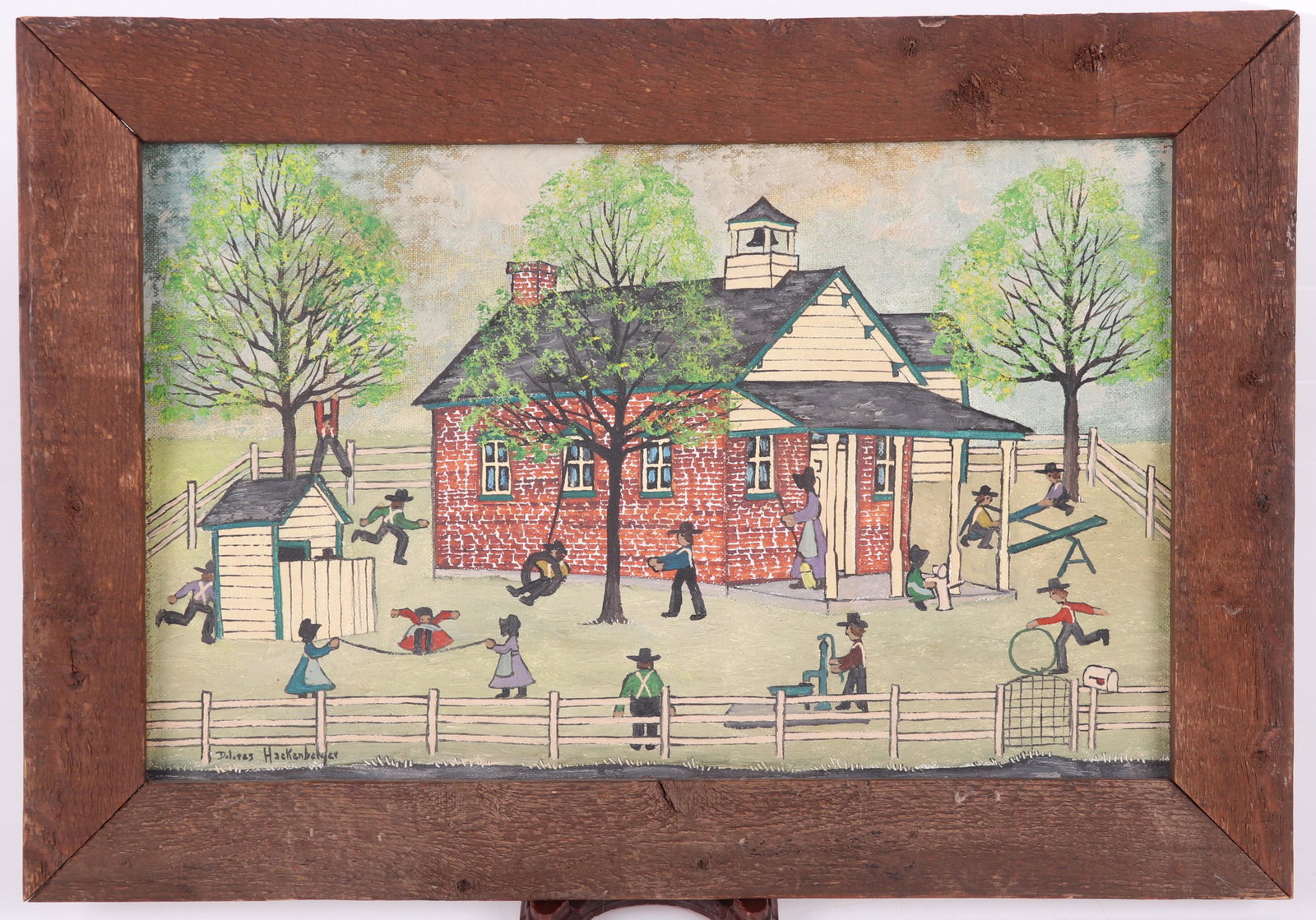 Dolores Hackenberge (born 1930) Oil on Artist Board: Depicting an Amish schoolhouse with figures, signed at the lower left corner. Dimensions: 9" x 14", the frame 11 3/4" x 16 3/4". Provenance: From a Philadelphia collection.