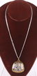 A Brass and Sterling Pendant by Jeep Collins
