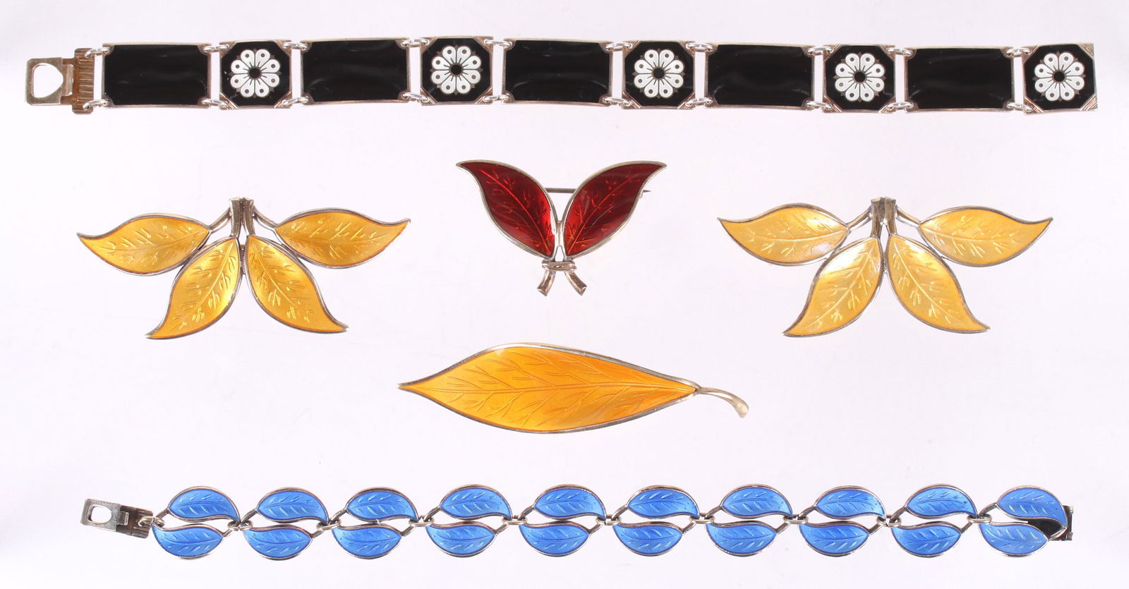David Andersen Norway, Sterling Jewelry: All sterling with enamel, a black bracelet with floral decoration, four foliate pins and a blue foliate bracelet. Dimensions:From 1 1/2" to 7 1/2" long, the total approximate gross weight is 2.1 troy