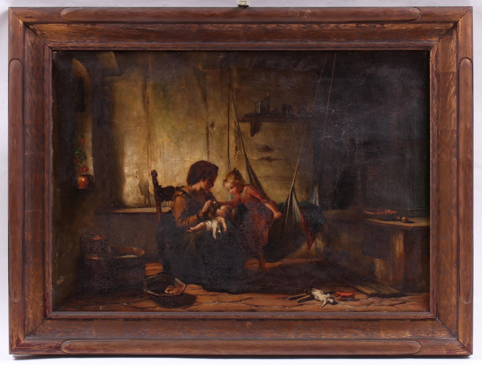 Continental School, 19th Century Oil on Canvas: An interior genre scene depicting a mother, child and baby, toys strewn on the floor. Unsigned. Dimensions:15 1/2" x 22 1/2", the frame 20 1/2" x 27 1/2". Provenance:From a local collection.