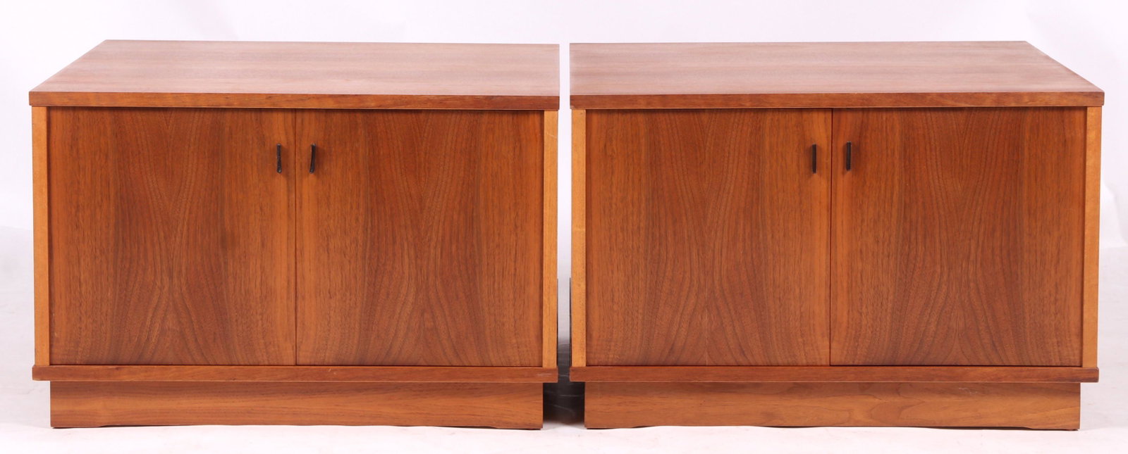Pair of Danish Modern Nightstands: Teak. Each with a platform base and two hinged doors. Dimensions:27 1/2" x 27 1/2". Height is 18". Provenance:From a local estate.