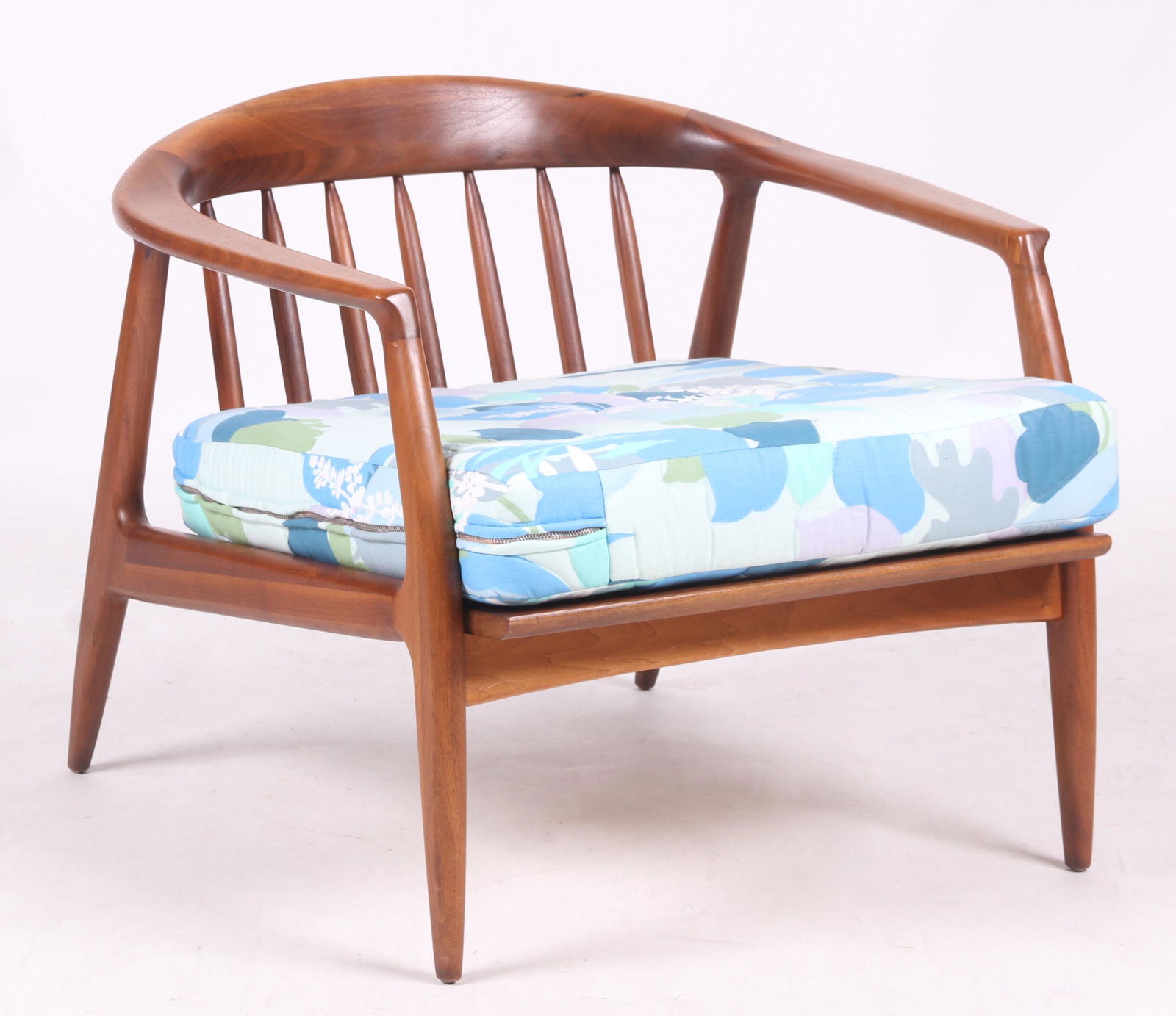 Folke Ohlsson for Dux, Teak Armchair: Swedish, unmarked. With tapered legs, horseshoe arms/back, and six spindles. Cushion is a replacement. Dimensions:25" arm to arm. 27 1/2" deep. Seat height is 15". Overall height is 24". Provenance:Fr