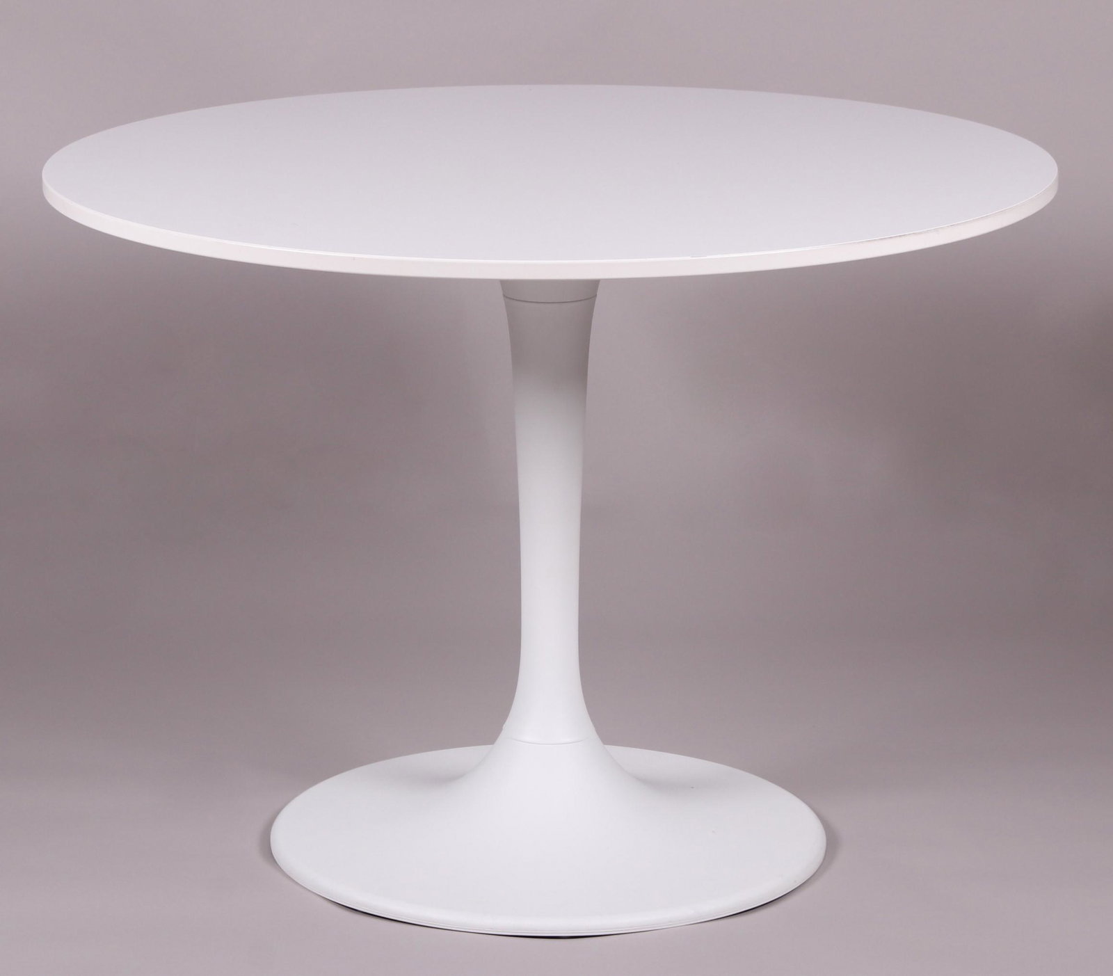 A Tulip Style Dining Table: Modern, by Ikea. Dimensions:The diameter is 41". The height is 29". Provenance:From a local estate.