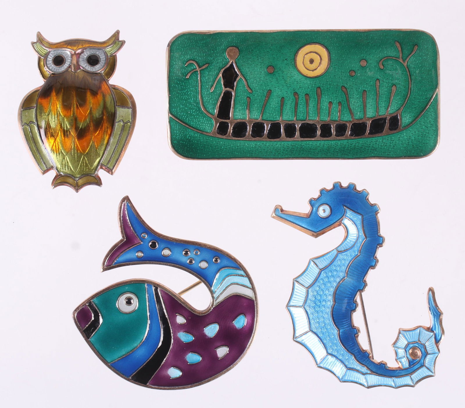 A Group of David Andersen Sterling Pins: All with enamel decoration, a large green pin designed by Nora Gulbrandsen, a fish form pin, a blue seahorse pin and a pin in the form of an owl. Dimensions:From 1 1/2" x 1" to 2 1/2" x 1 1/8". The to
