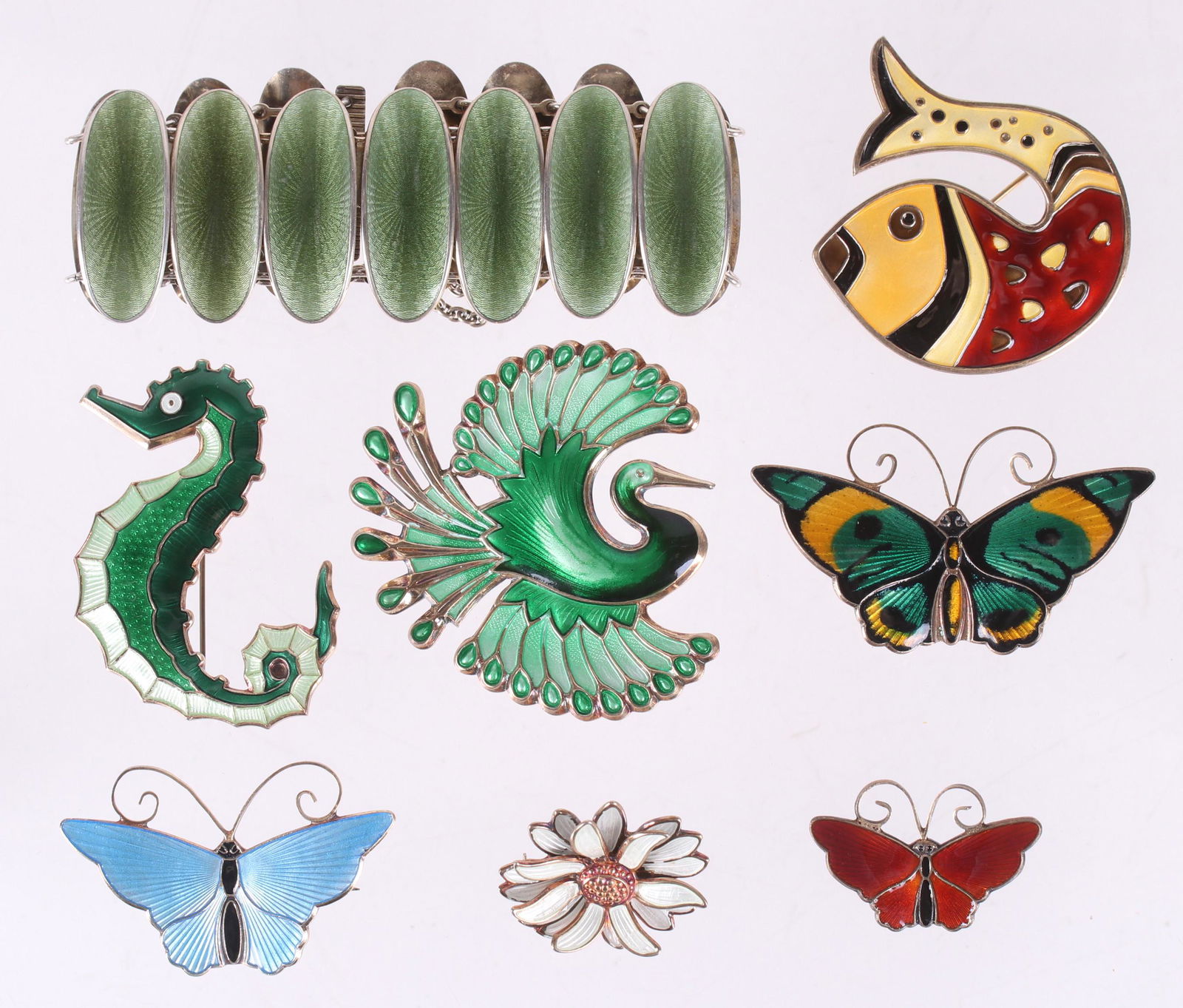 A Group of David Andersen Sterling Jewelry: All with colorful enamel and signed for the maker, comprising: three butterfly pins, a green bracelet, a green heron brooch, a daisy form pin, a fish pin and a green seahorse pin. Dimensions:From 1" x