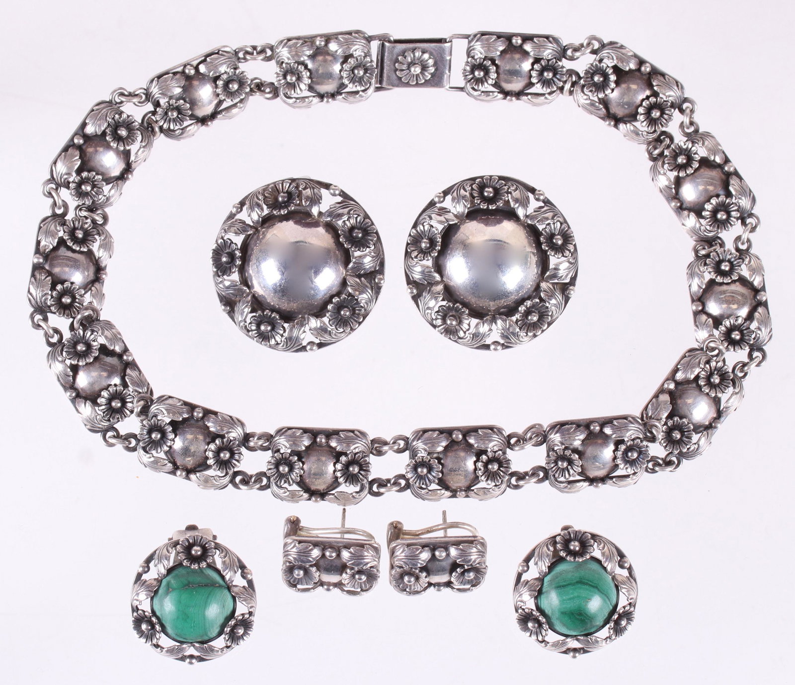 Group of N.E. From Sterling Jewelry: A floral decorated choker necklace and three pairs of matching earrings. All signed. Dimensions:The necklace is 15" long, the earrings range from 3/4" x 1/2" to 1 3/8" in diameter, the total approxima