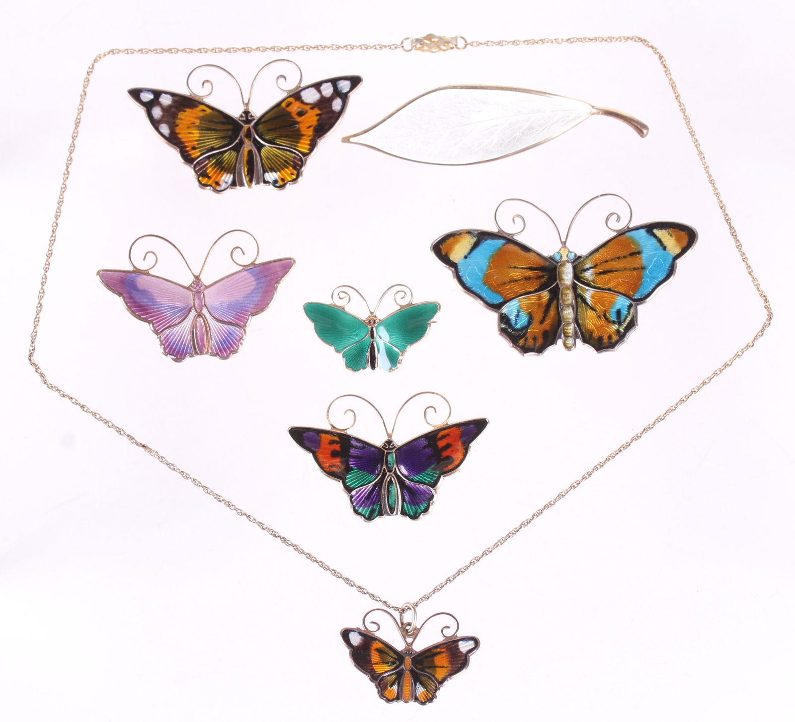 David Andersen, Sterling Butterfly Pins, Etc.: All with colorful enameling, marked as pictured. A sterling leaf form pin, and a sterling butterfly pendant is also included in the lot. Dimensions:From 1 1/8" x 3/4" to 2 1/2" x 1 1/2", the total app