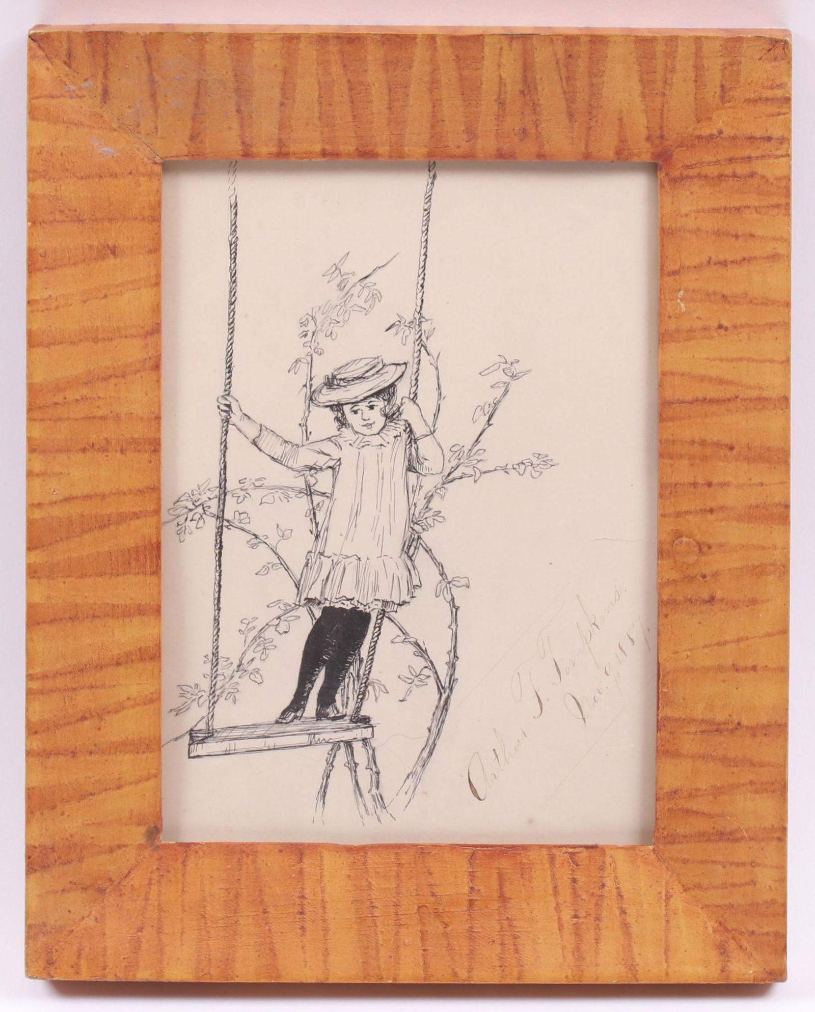 American School Pen & Ink Portrait Dated 1887: A small work, pen and ink on paper depicting a child standing on a swing, signed "Arthur F. Tompkins: and dated Nov. 9th, 1887. With what appears to be the original grain painted frame. Dimensions:The