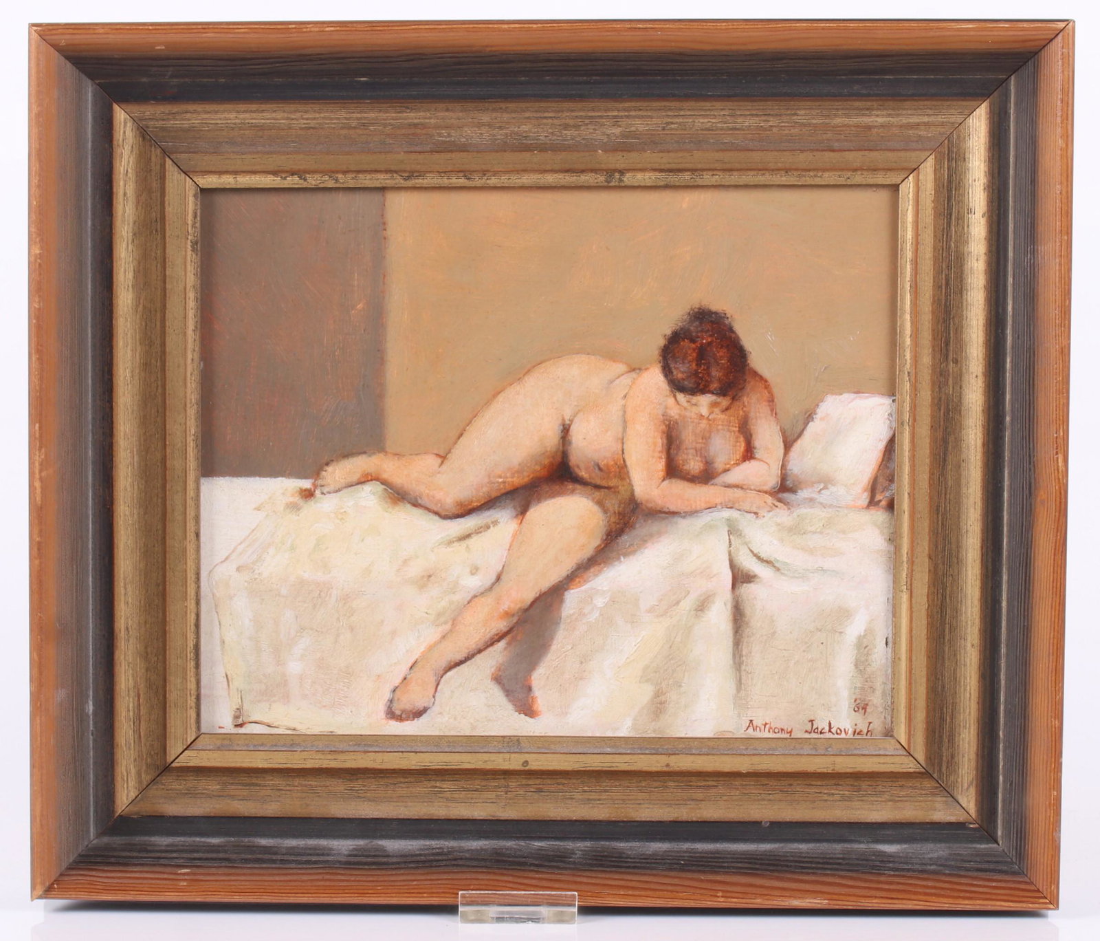 Anthony Jackovich (Born 1923) Oil on Board: Depicting a nude in bed, signed and dated for 1964 at the lower right corner. Dimensions:8" x 10", the frame 12" x 14". Provenance:From a Philadelphia estate.