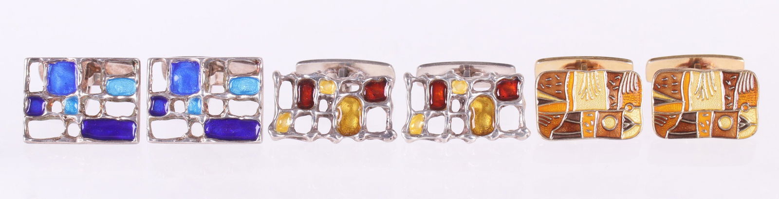 Three Sets of David Andersen Sterling Cufflinks: Each in a Modernist design and with enameled elements, signed as pictured. Dimensions:From 1" x 5/8" to 1" x 3/4". The total approximate gross weight is 1.3 troy ounces. Provenance:From a local collec