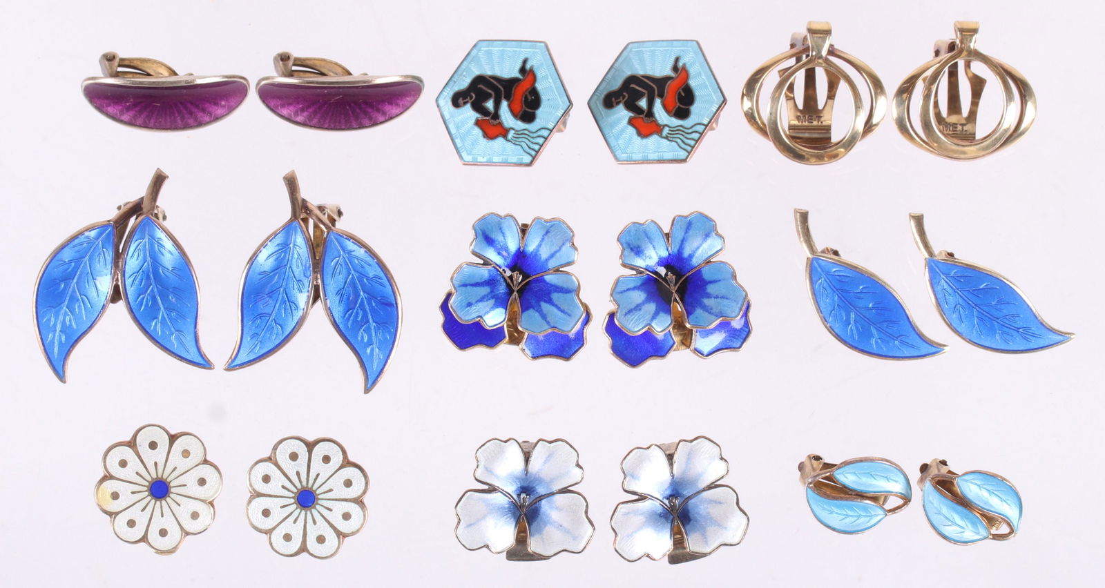 A Group of David Andersen Sterling Earrings: Nine pairs of earrings, various forms and decoration, all but one pair are enameled. Dimensions:From 3/4" x 1/2" to 1 1/4" x 1". The total approximate gross weight is 2 troy ounces. Provenance:From a