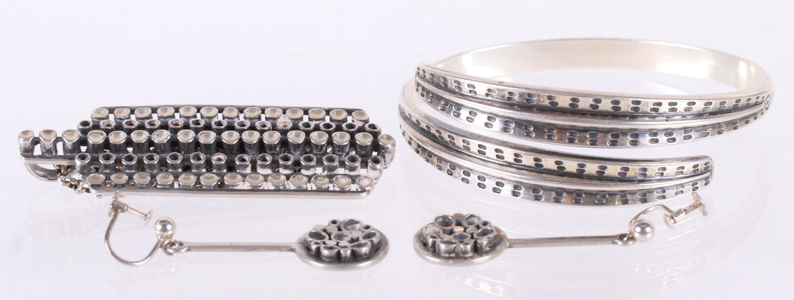 David Andersen Sterling Jewelry: A bangle bracelet, a pendant and a pair of earrings , marked as pictured. Dimensions:The bracelet is 2 3/4" x 2 3/8", the pendant is 2 3/4" x 1" and each earring is 1 1/2" long. The total approximate