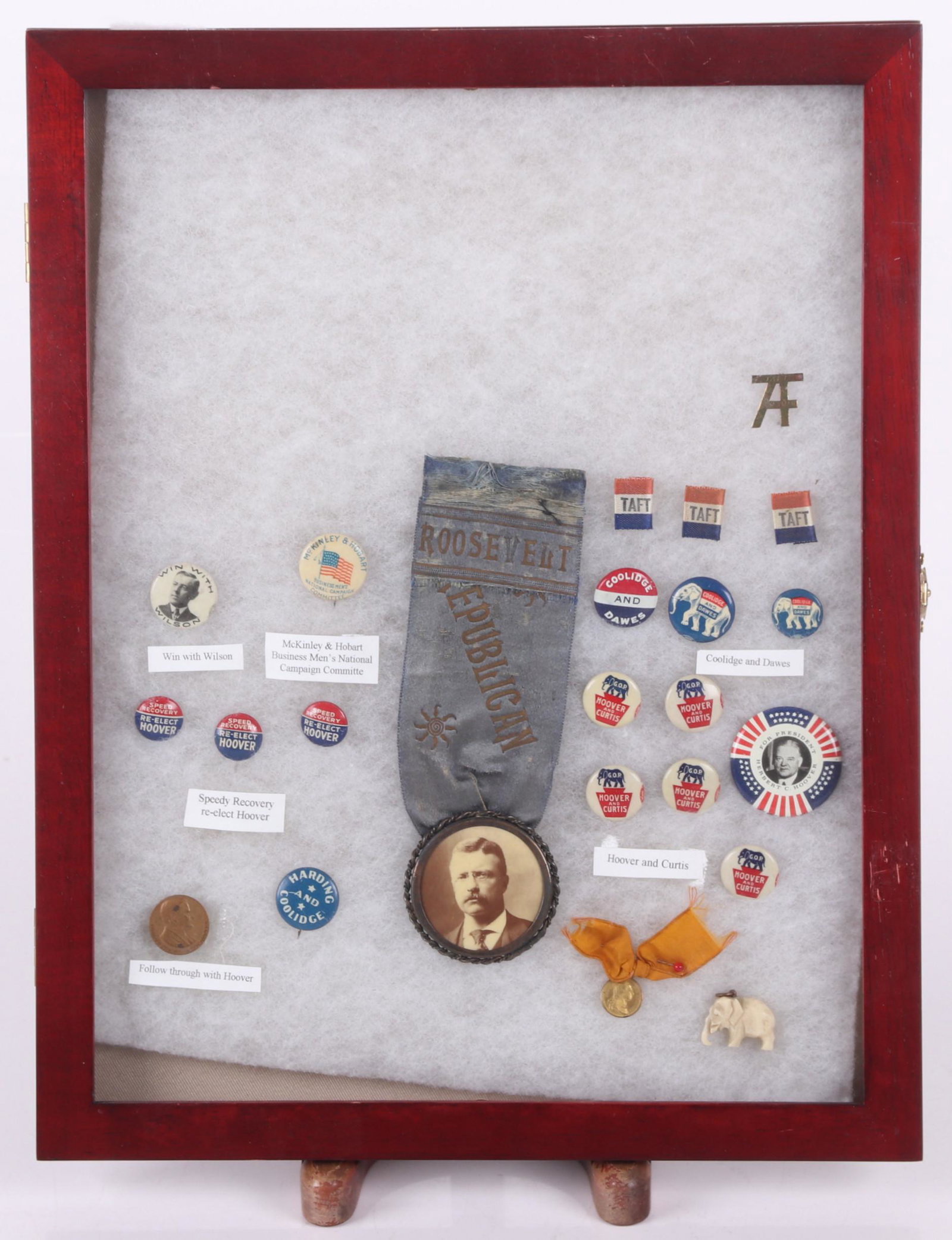 A Group of Political Buttons - Roosevelt, Hoover: Examples for Roosevelt, Taft, Hoover, Coolidge, Wilson. Dimensions:From 1/2" in diameter to 6" x 2". Provenance:From a local estate.
