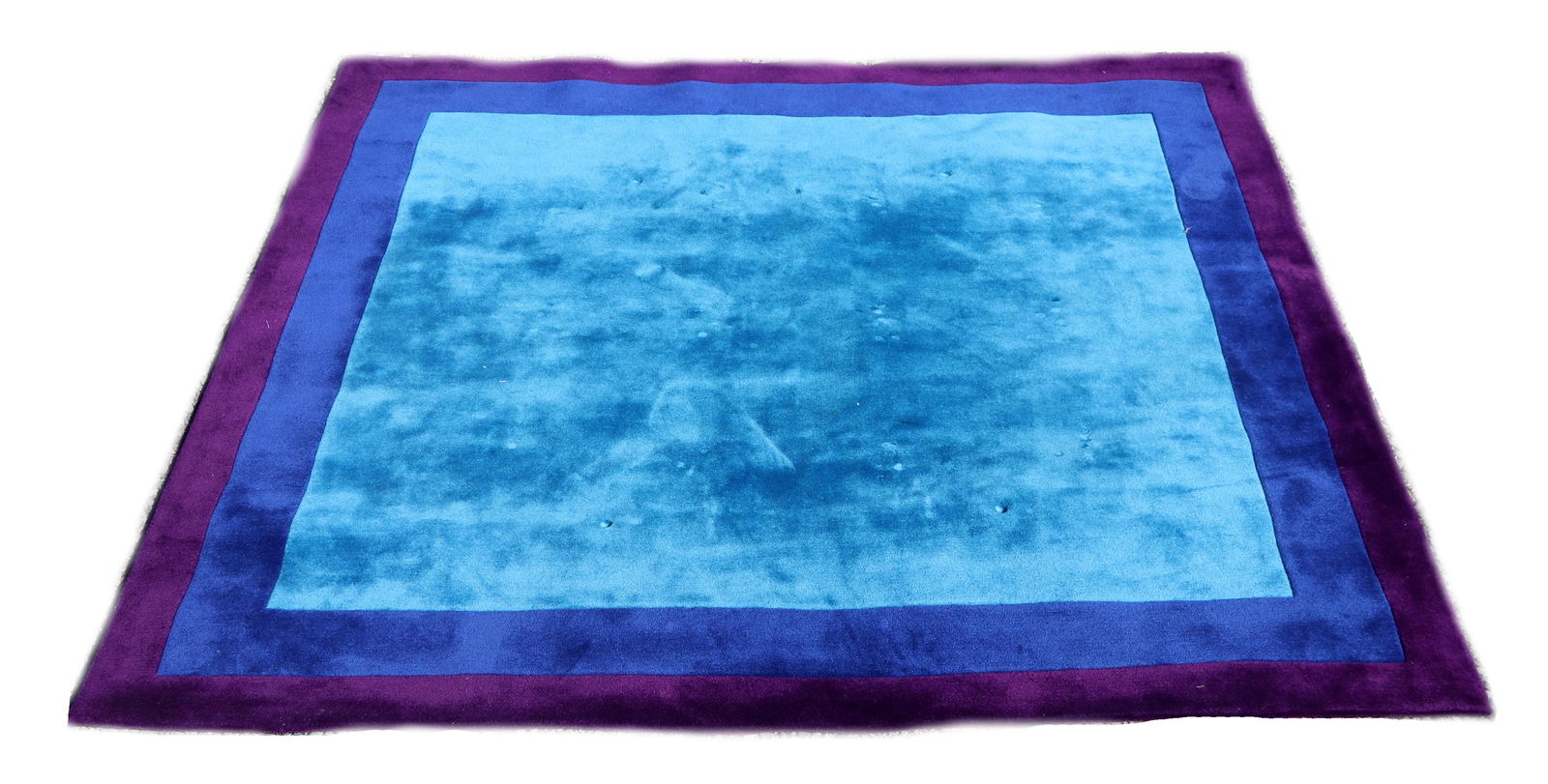 Edward Fields Modernist rug/carpet: American made with a copyright from 1985. In a modern square within square design including azure blue, cornflower blue and aubergine. Dimensions:Approximately 9' x 9'. Provenance:From a local estate.