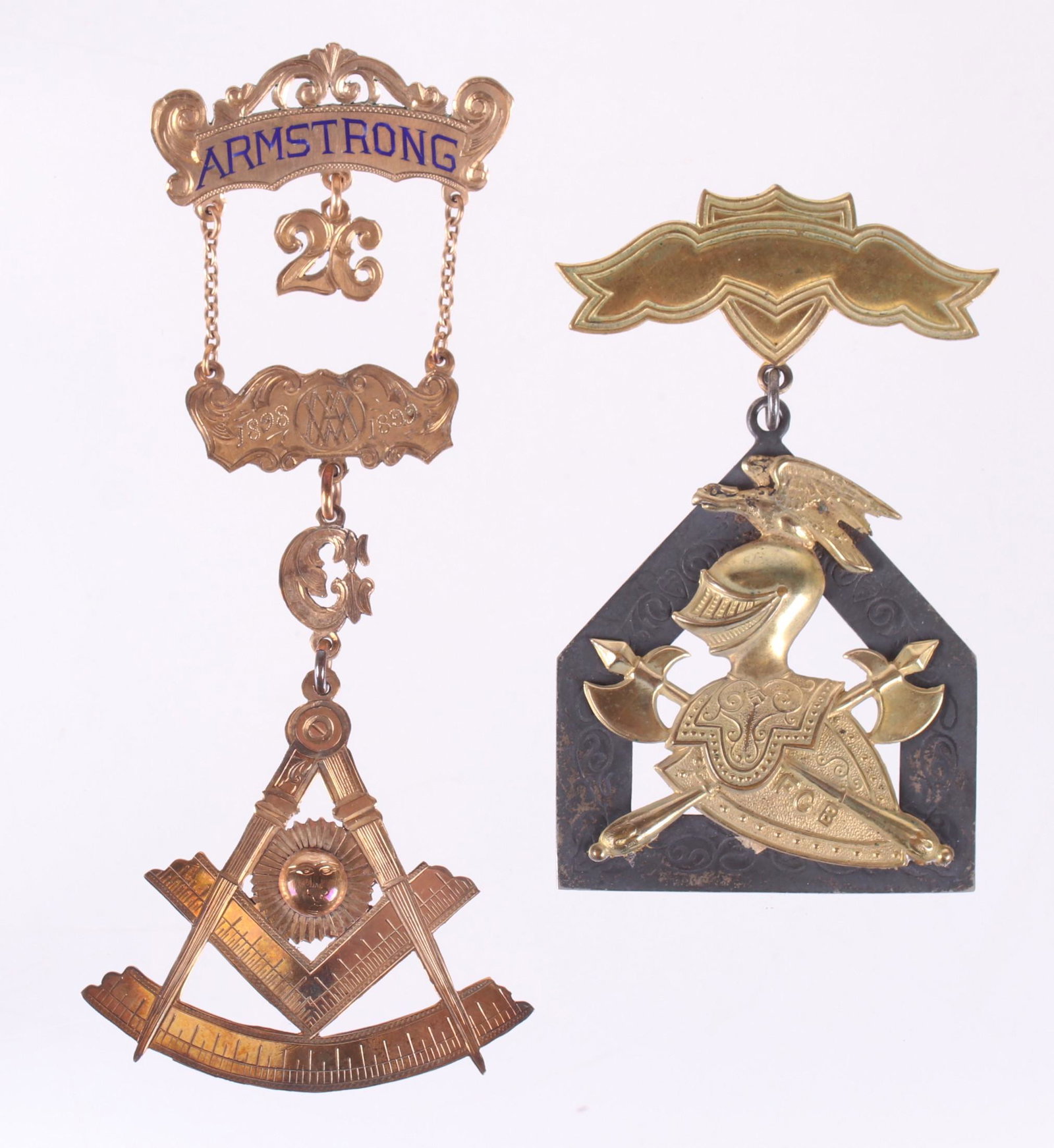 Two Fraternal Badges, One Masonic: A Knights of Pythias badge decorated with armor and a 14k gold three part Masonic badge dated for 1899 and inscribed "Presented to WM A. Mullin by Armstrong Lodge No. 26, Newport Delaware". Dimensions