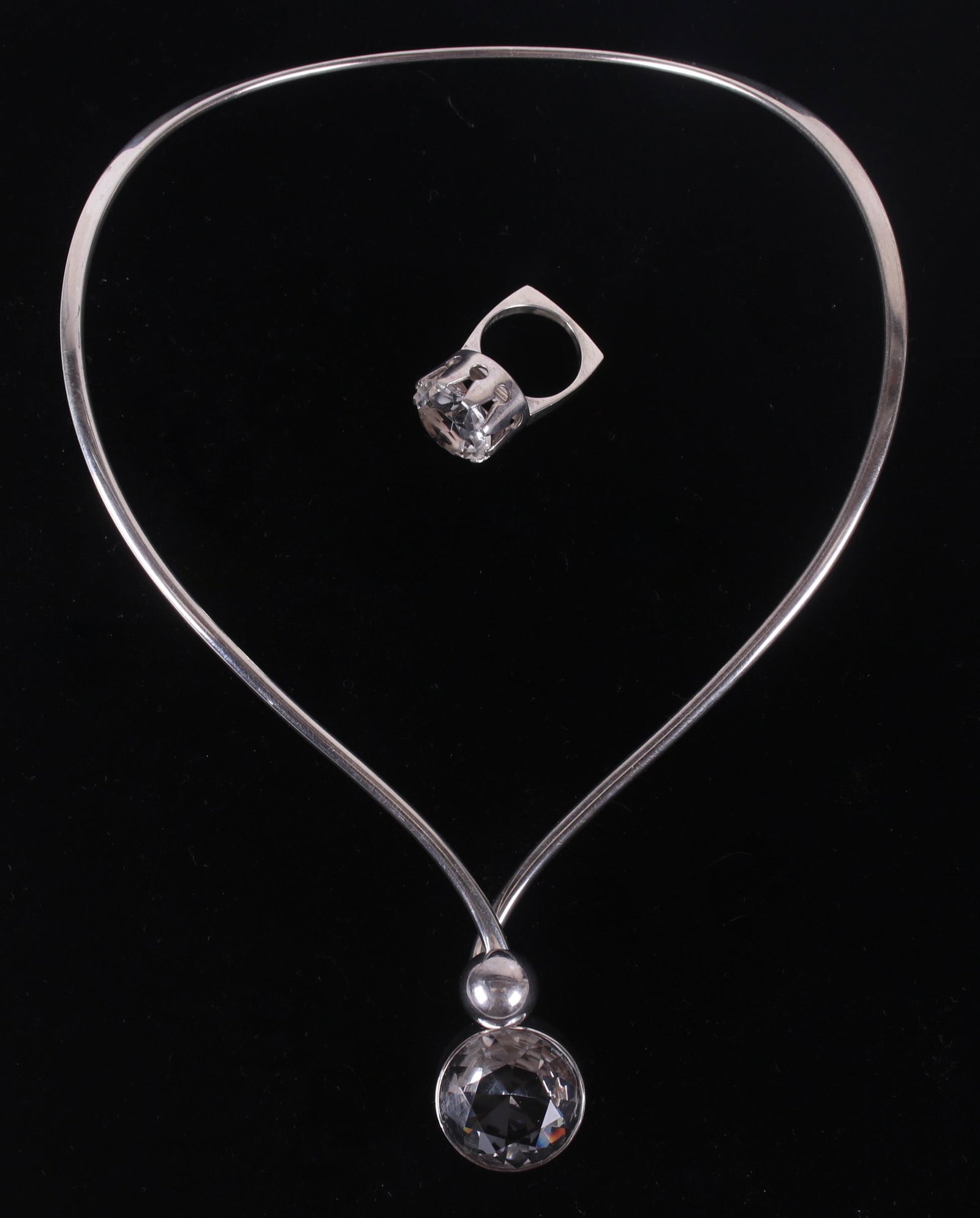Danish Sterling Jewelry, N.E. From, Ulrichsen: A ring set with glass by Henning Ulrichsen and a choker necklace also set with glass by N.E. From. Each signed as pictured. Dimensions:The necklace is 5" x 7 1/4", the ring is a size 5 1/4. The total 