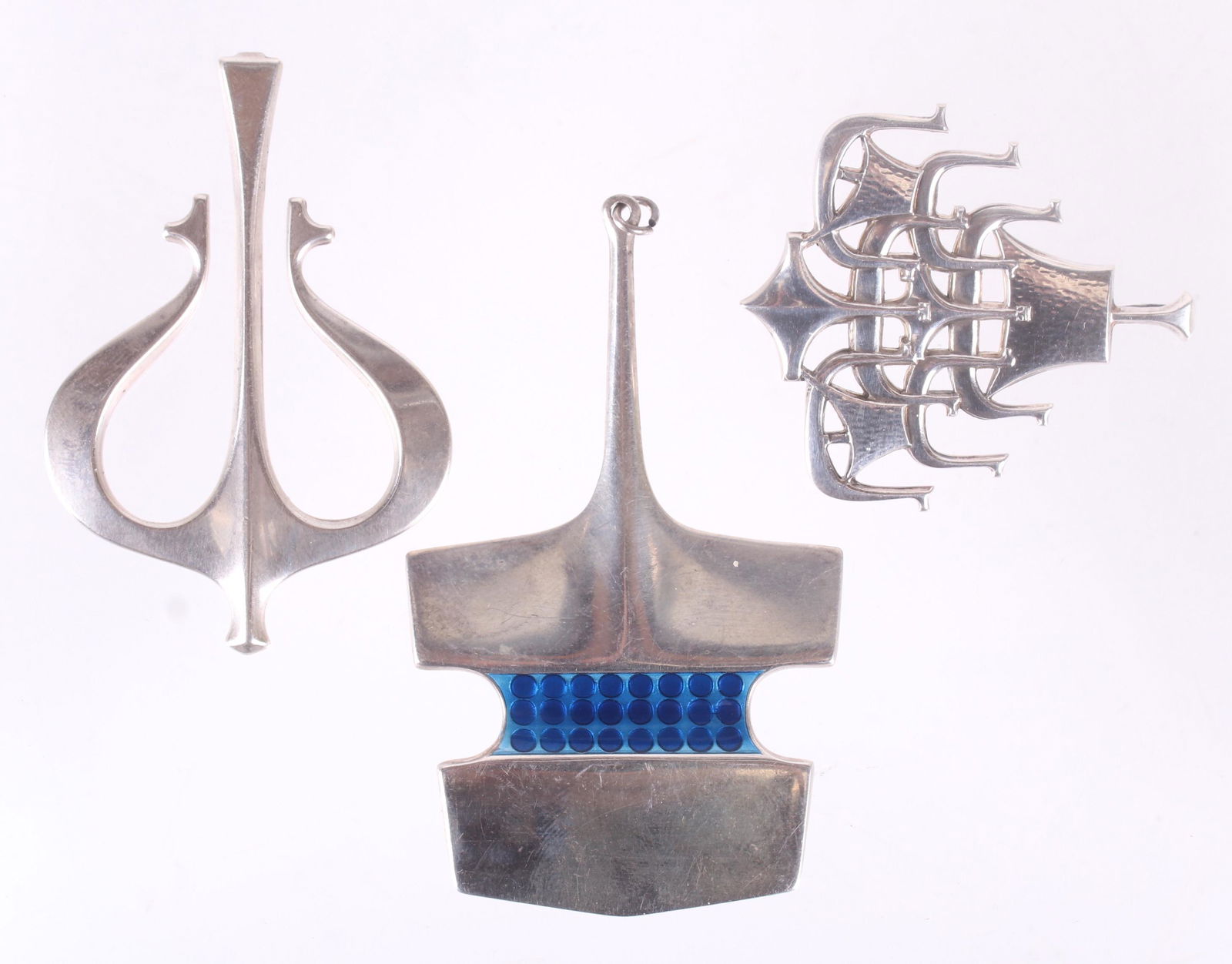 Three Sterling Modernist Pendants, Andersen: Three vintage pendants by David Andersen, one with blue enamel. Dimensions:From 2" x 1 3/4" to 3 1/8" x 1 7/8", the total approximate gross weight is 2.1 troy ounces. Provenance:From a local collectio