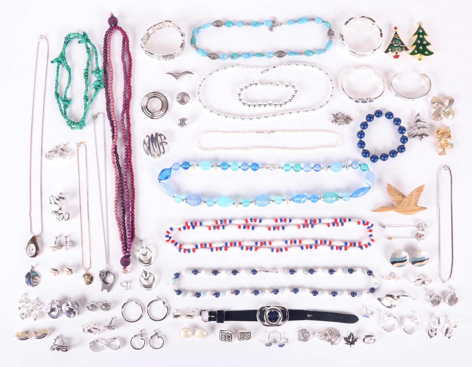 A Group of Jewelry, Costume and Sterling: The sterling pieces are two Mexican bracelets, three pins, four pendants, a pair of earrings, a single earring, a chain and a stick pin. The costume pieces include necklaces, pins, bracelets and earri