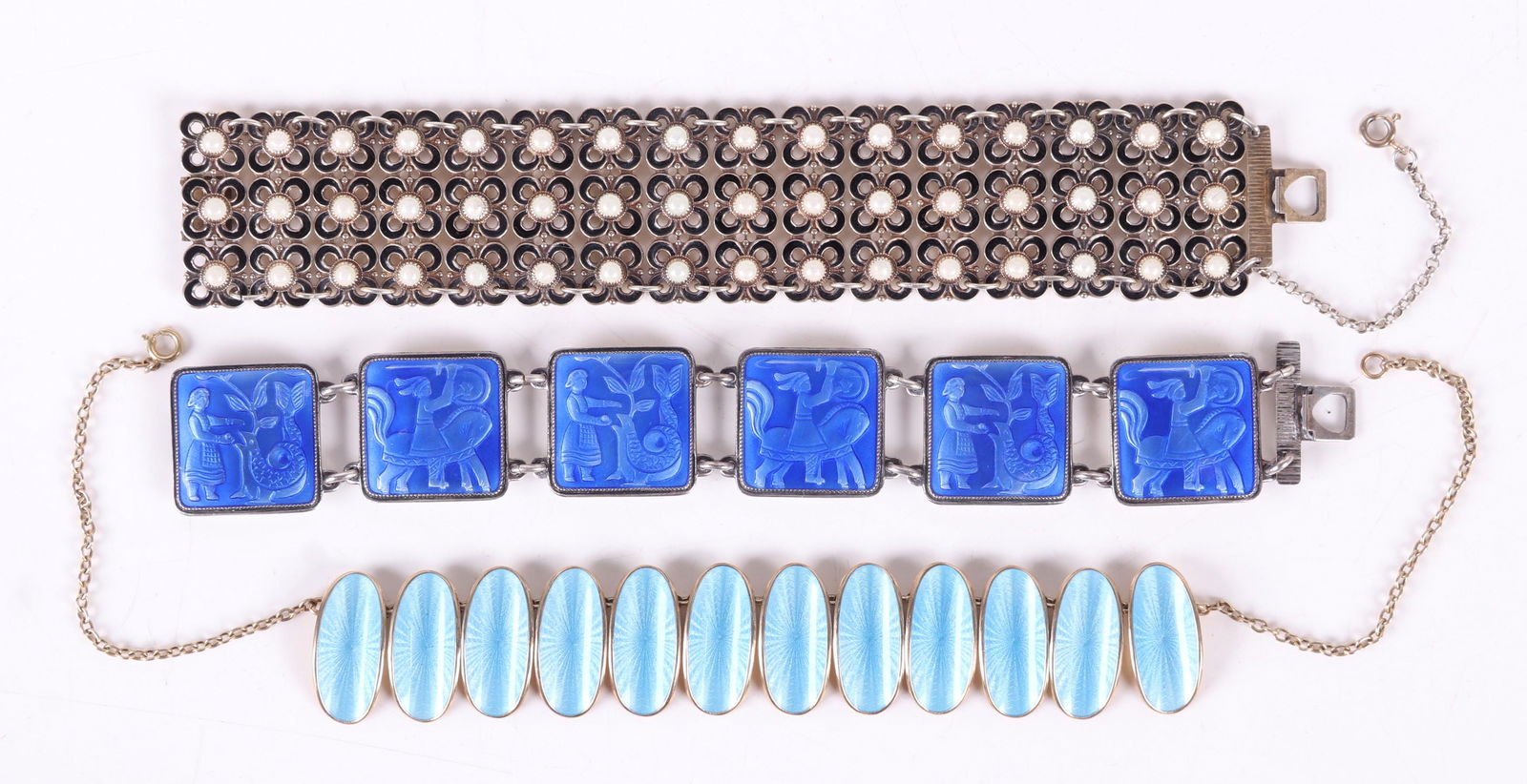 Two Sterling Bracelets and a Necklace, Scandinavian: All three by David Andersen, one with six enameled links that have figural decoration, another with black and white floral links and the third with oval blue links, all signed. Dimensions:From 1" x 6"