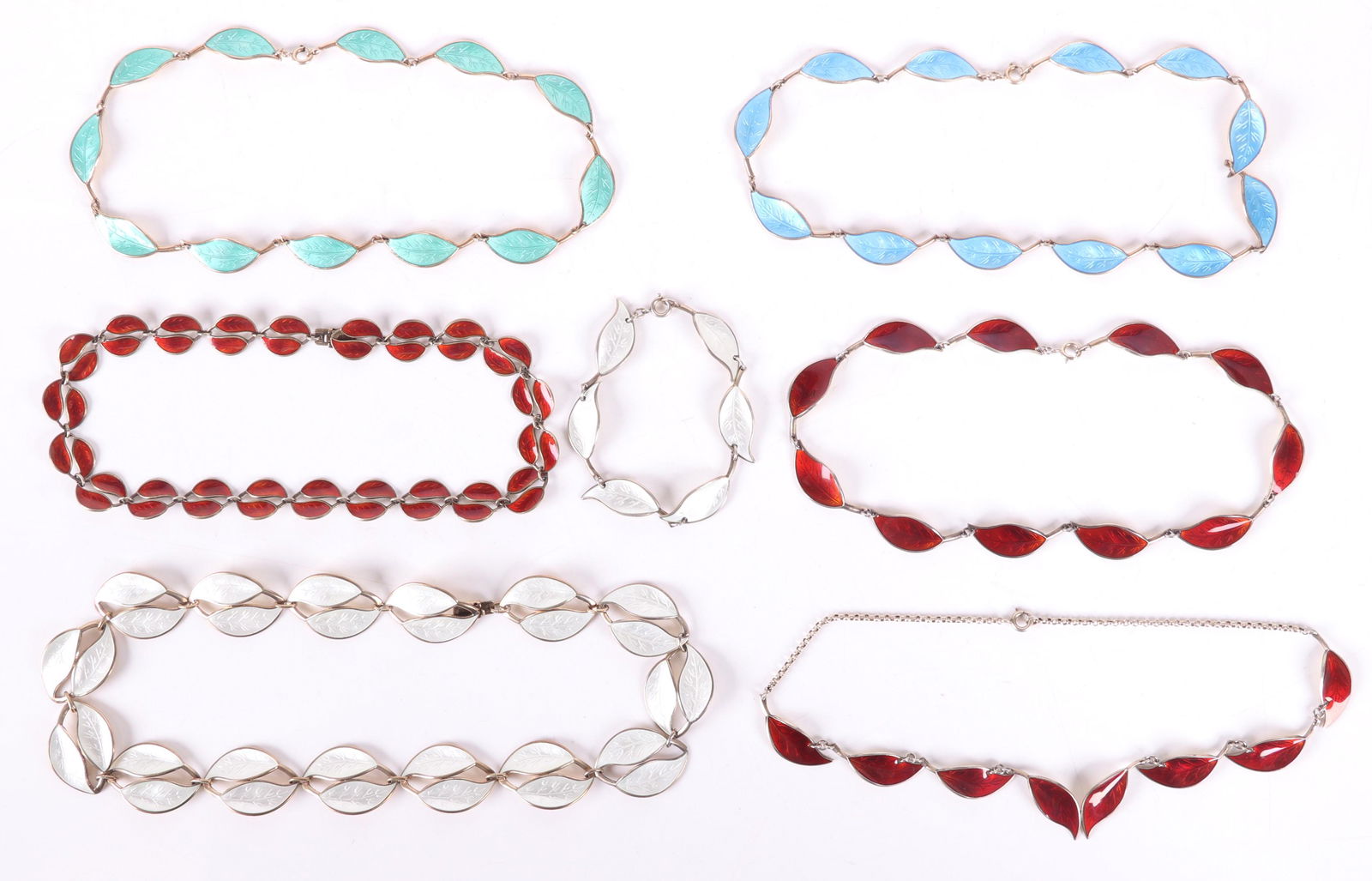 A Group of David Andersen Sterling Jewelry: A group of sterling and enamel foliate jewelry, five necklaces and two bracelets, all signed. Dimensions:From 7" to 18" long. The total approximate weight is 6 troy ounces. Provenance:From a local col