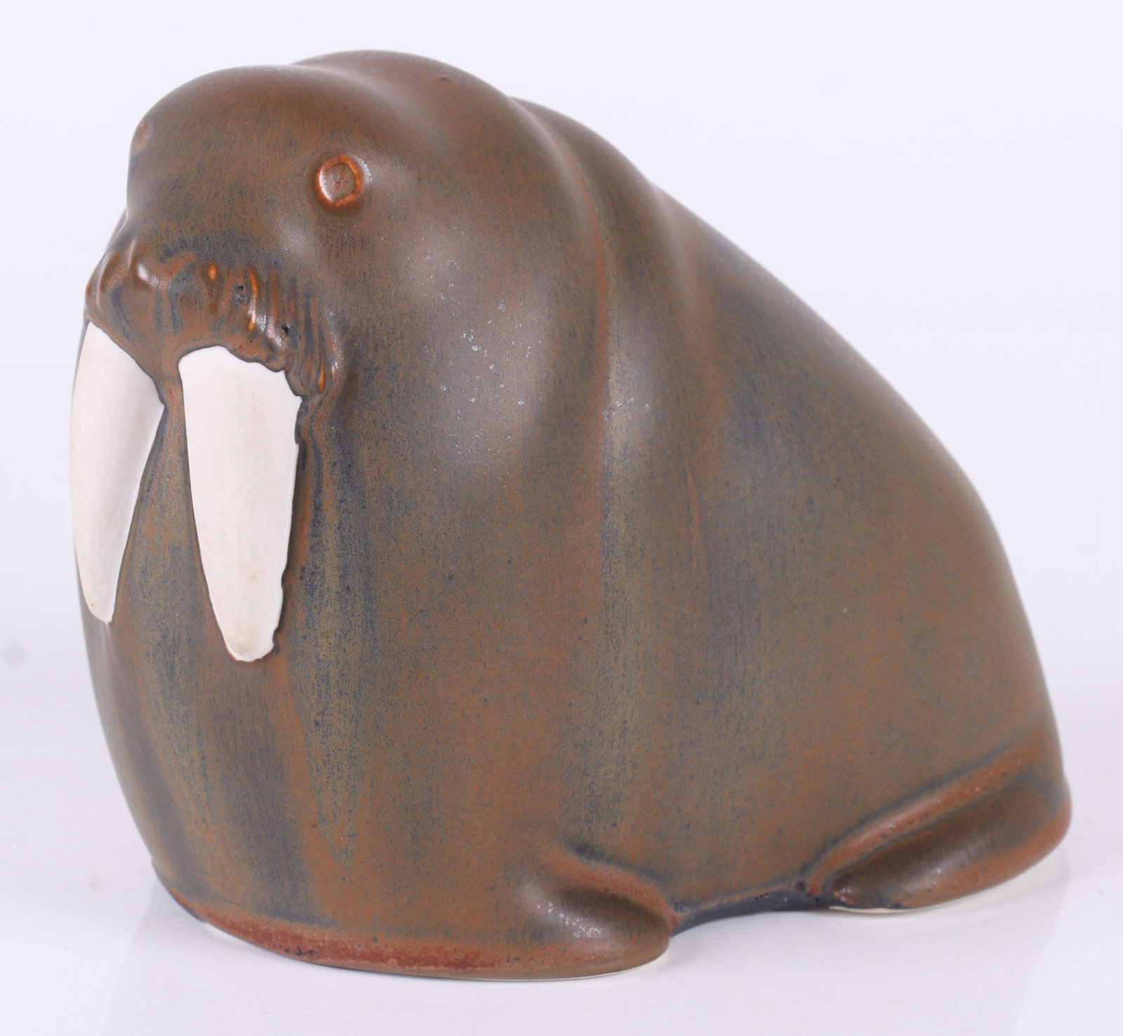 A Finnish Arabia Pottery Walrus Figure: 20th century, marked as pictured. Dimensions:8" x 4 1/2", 6" tall. Provenance:From a Philadelphia collection.
