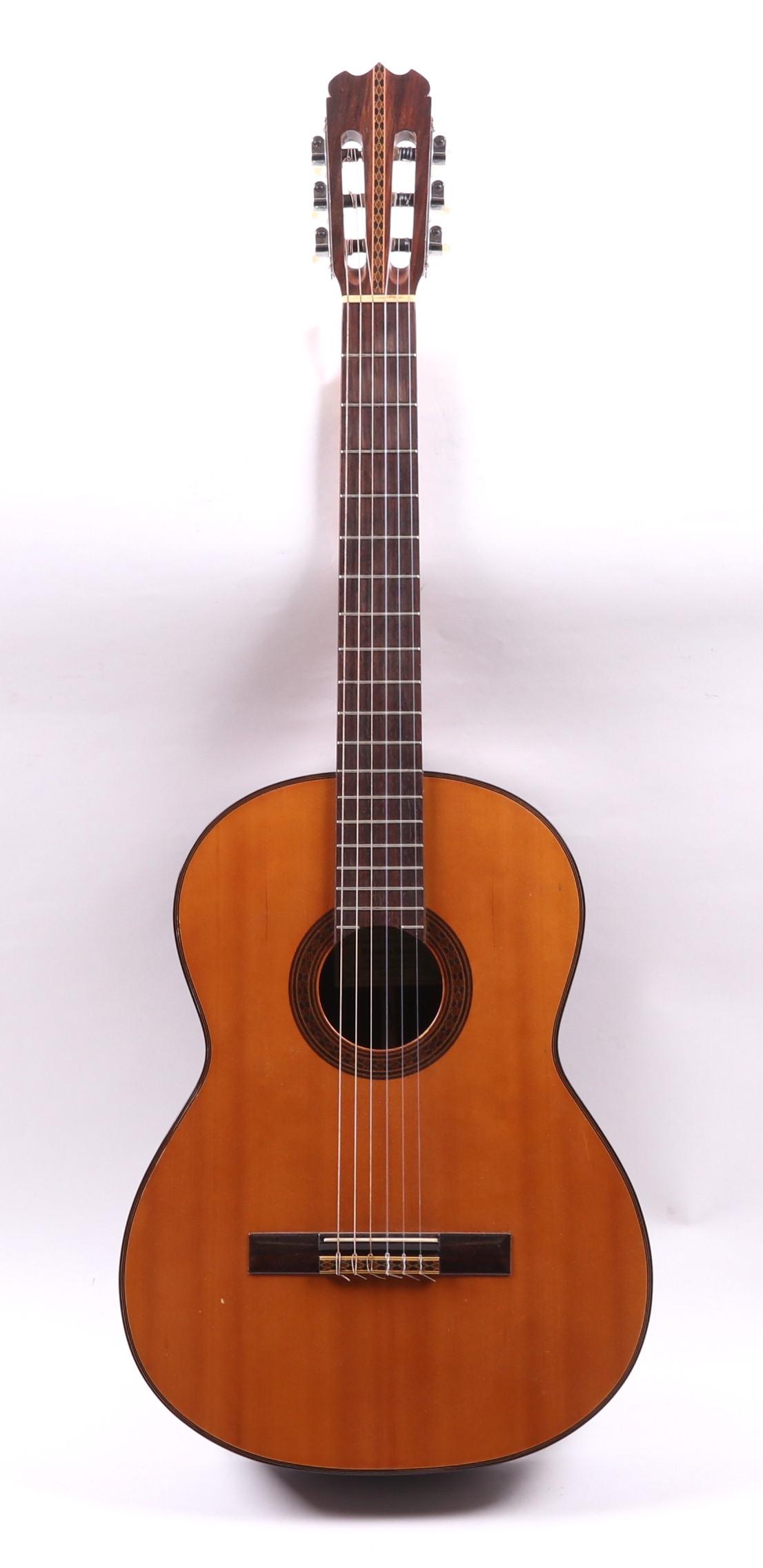 An Acoustic Guitar, Federico Garcia, 1967: A six string guitar with decorated sound hole and labeled as pictured. Includes hard case. Dimensions: The case measures 40" x 16" x 5". Provenance: From a local collection.
