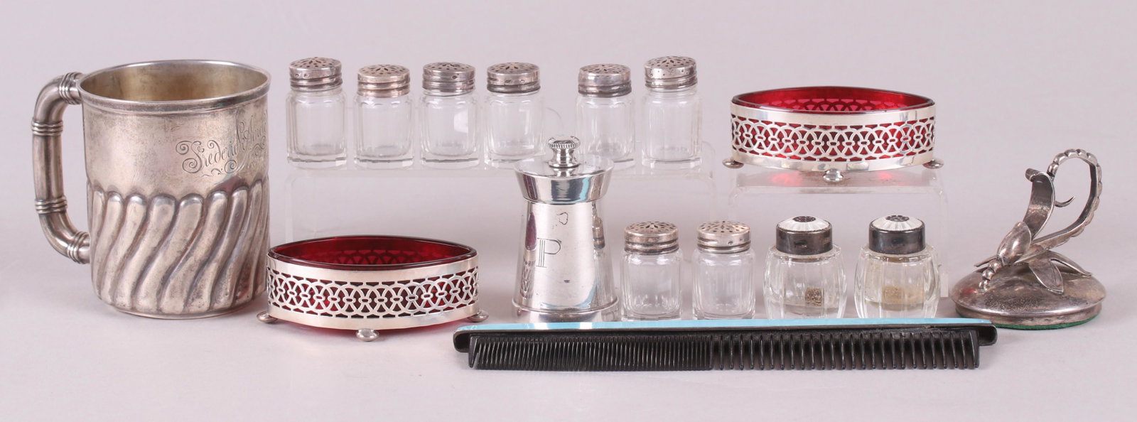 An Estate Lot, Small Sterling Silver Items: Comprising: a child's cup by Gorham inscribed "Frederick Arnold Merritt, November 5th, 1884", a Georg Jensen style paper weight simply marked "Sterling", an Italian pepper grinder with a wooden interi