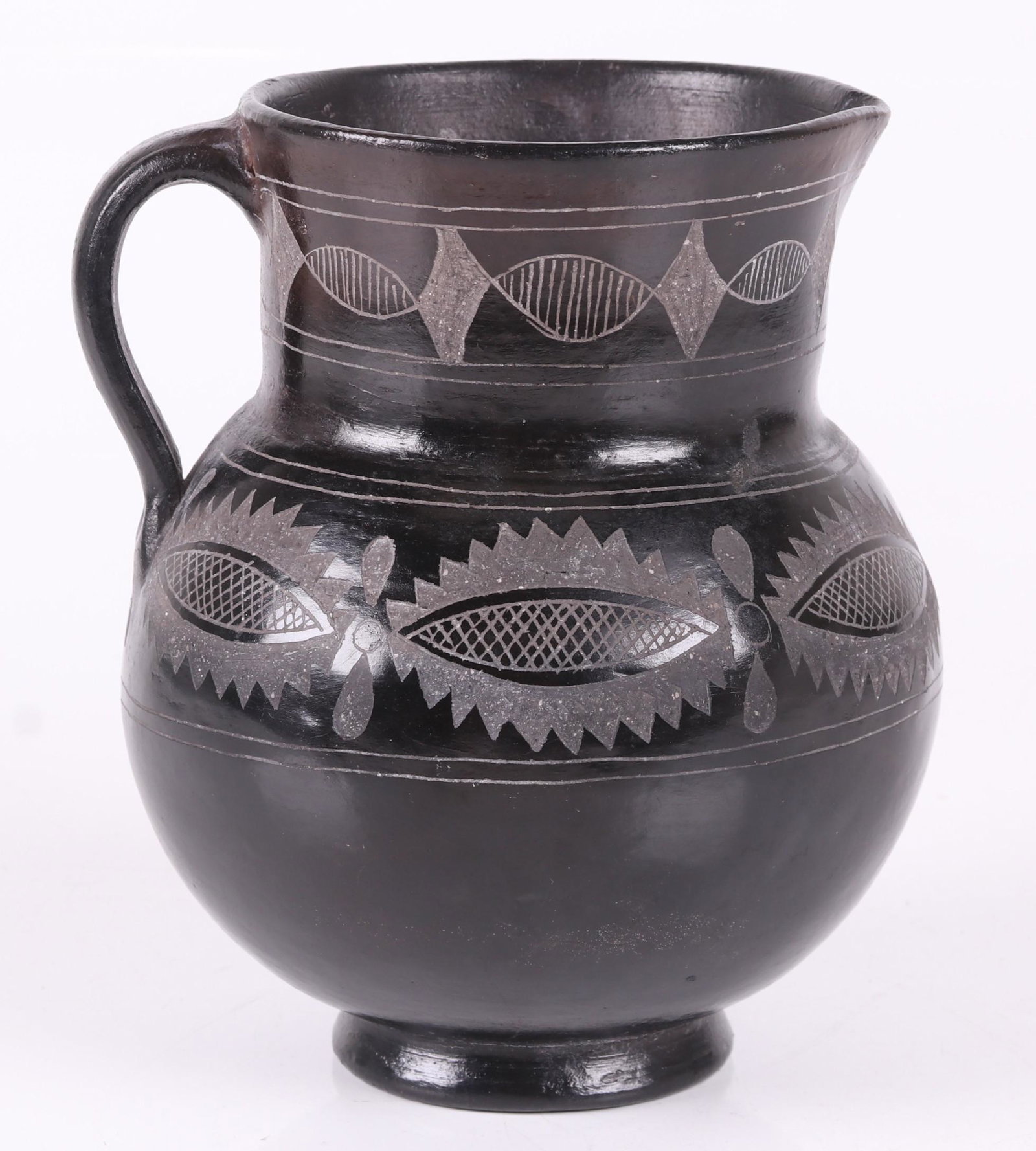 Pablo Mateos, Mexico, Pottery Pitcher: With applied handle and incised decoration, marked as pictured. Dimensions: 5 1/2" from handle to spout, 7" tall.