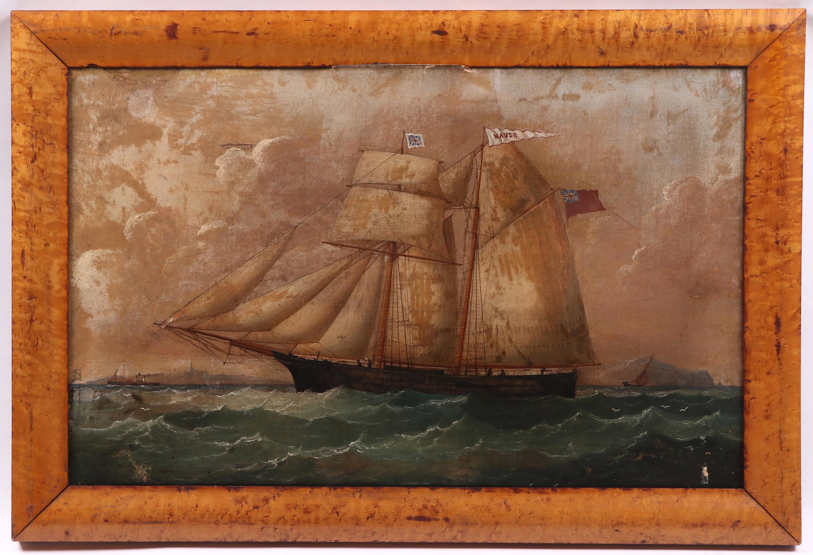 English School, 19th Century, Oil on Canvas: Depicting a clipper ship bearing English flags and a flag that reads "Maude". Unsigned, the bird's eye maple frame appears to be original. Dimensions: 17" x 27 1/2". Provenance: From a local collectio