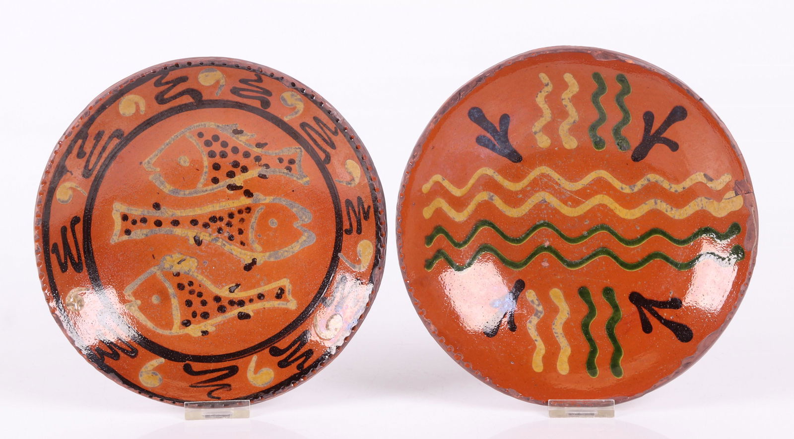 Two Shooner Redware Pie Plates: Each with slip decoration, both signed and dated for 1997 as pictured. Dimensions: Each has a diameter of 8 3/4". Provenance: From a local collection.