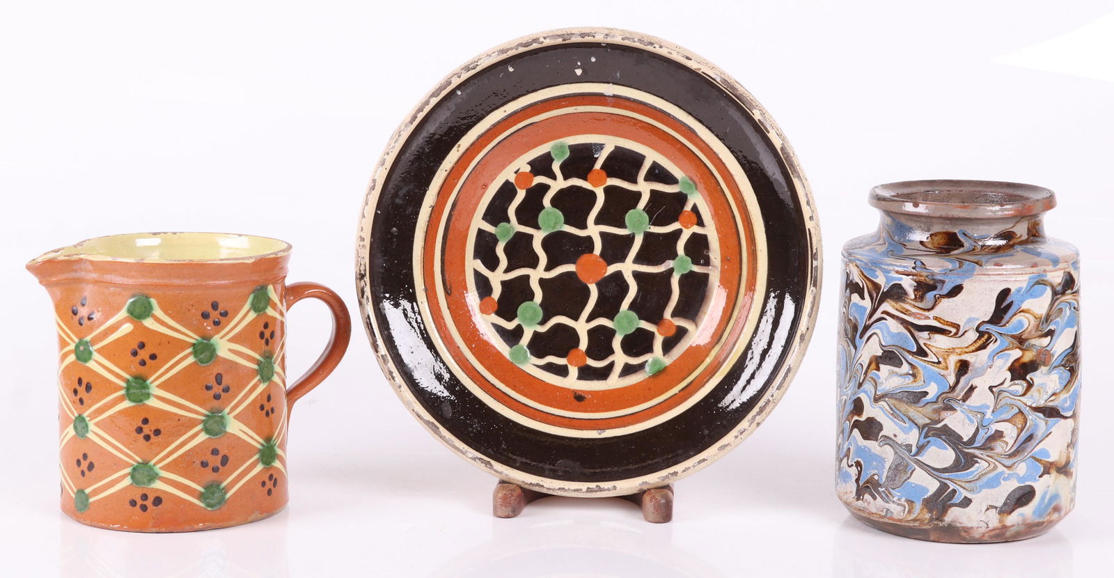 Three Pieces of French Pottery: A marbleized jar, a Primavera Studio bowl with crosshatch and dot decoration and a Jaspe pitcher with green, white and black decoration. Dimensions: From 6" to 11 1/2" in diameter, the heights range f