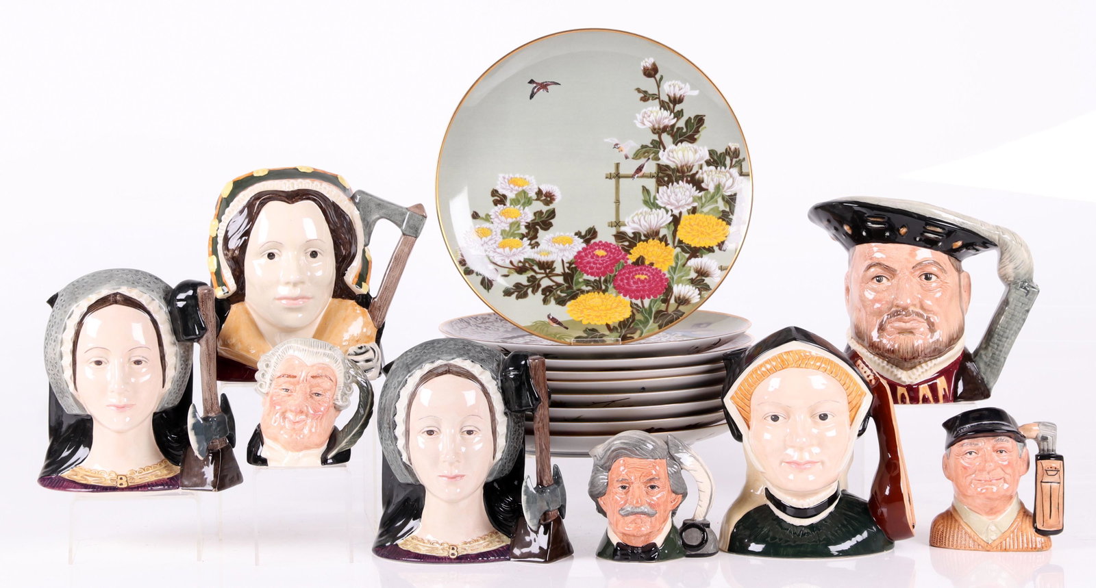 A Group of Royal Doulton Toby Mugs, Etc...: Comprising: two large Anne Boleyn toby mugs, a large Jane Seymour mug, a large Henry VIII toby, a large Catherine Howard toby, a small Golfer toby, a small Mark Twain toby, a The Lawyer small toby, an