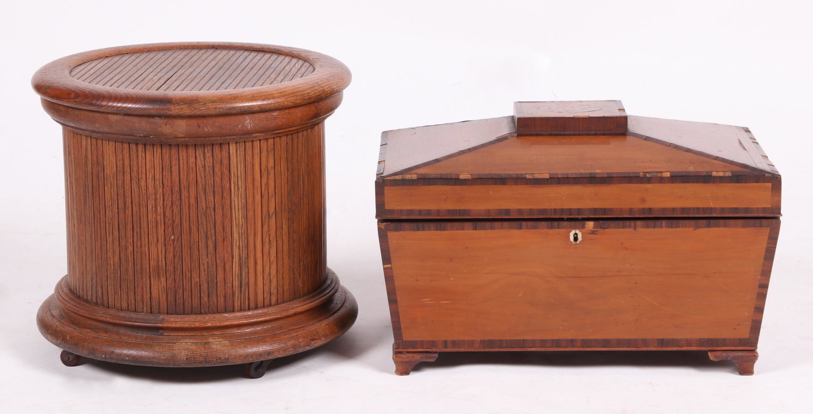 A Large Georgian Mahogany Tea Caddy: A large sarcophagus form caddy with ogee bracket feet, rosewood banding and five interior lidded compartments. Together with an oak commode circa 1900. Dimensions: The caddy is 13" x 21" and 14" tall,