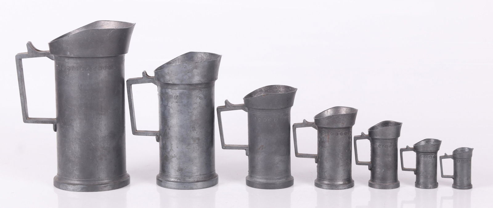 A Set of Pewter Graduated Measures (1 of 8)