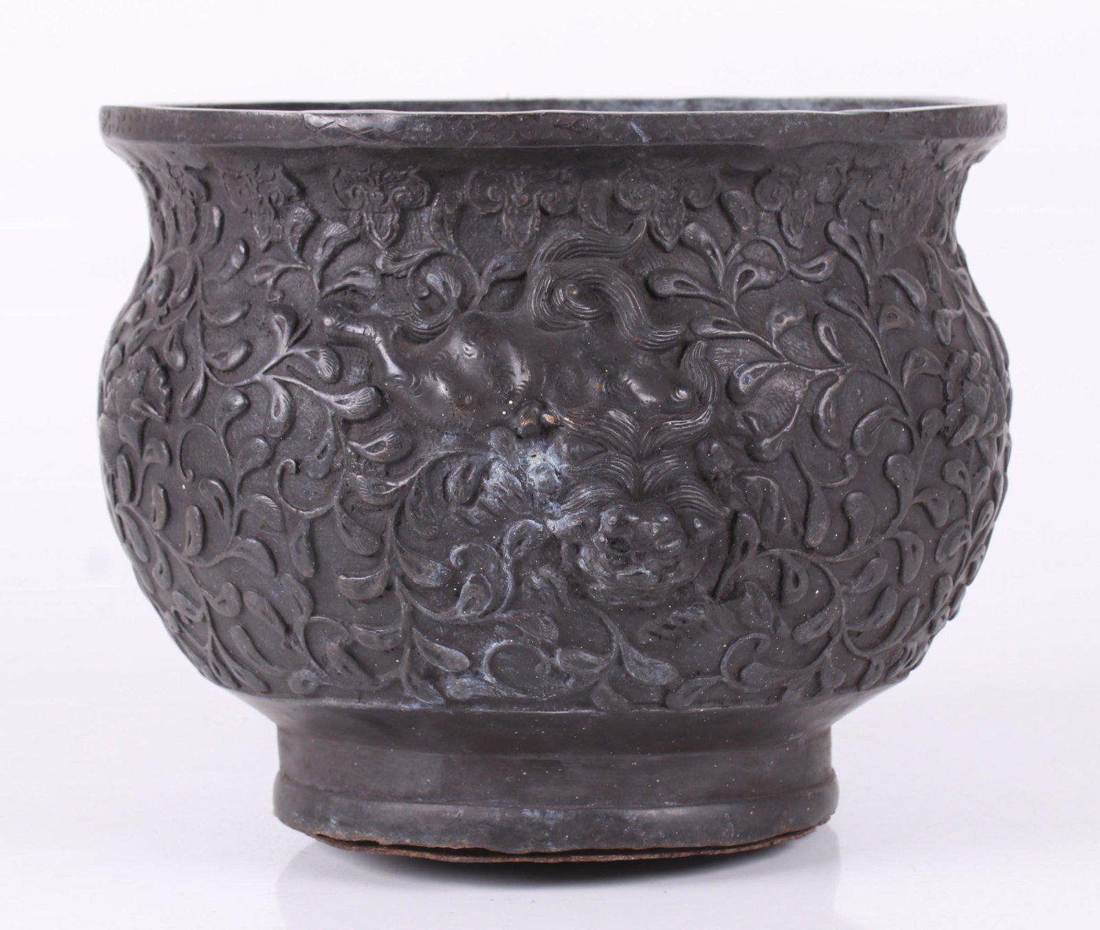 An Asian Bronze Jardiniere: Late 19th or early 20th century, with relief decoration which includes foo dogs. Dimensions: 9 1/2" in diameter, 7 1/2" tall.