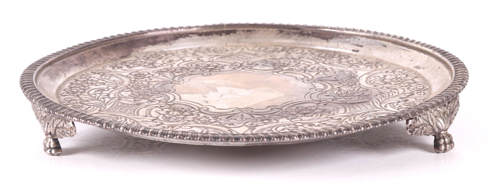 Scottish Sterling Salver, Glasgow, Historical: A circular example with three paw and acanthus leaf feet below the body with a gadrooned edge and elaborate rococo decoration. Hallmarked for Glasgow, 1822 and the maker Mitchell and Son. The engraved
