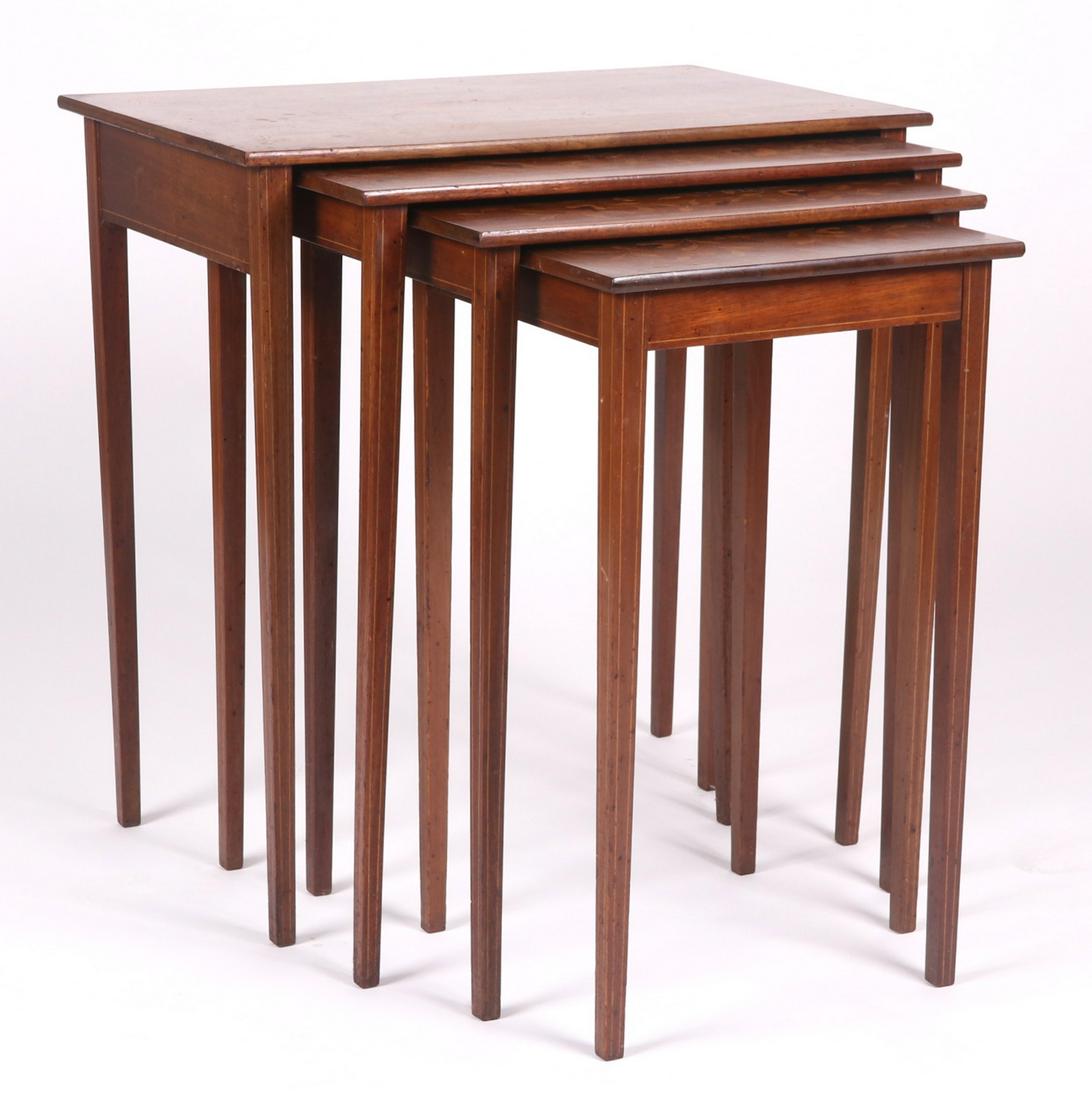 A Set of Marquetry Nesting Tables: Early 20th century, Continental. Mahogany, each with elaborate marquetry decoration and square tapered legs. Dimensions: From 16" x 16" to 17 1/2" x 28", the heights range from 26" to 30". Provenance: