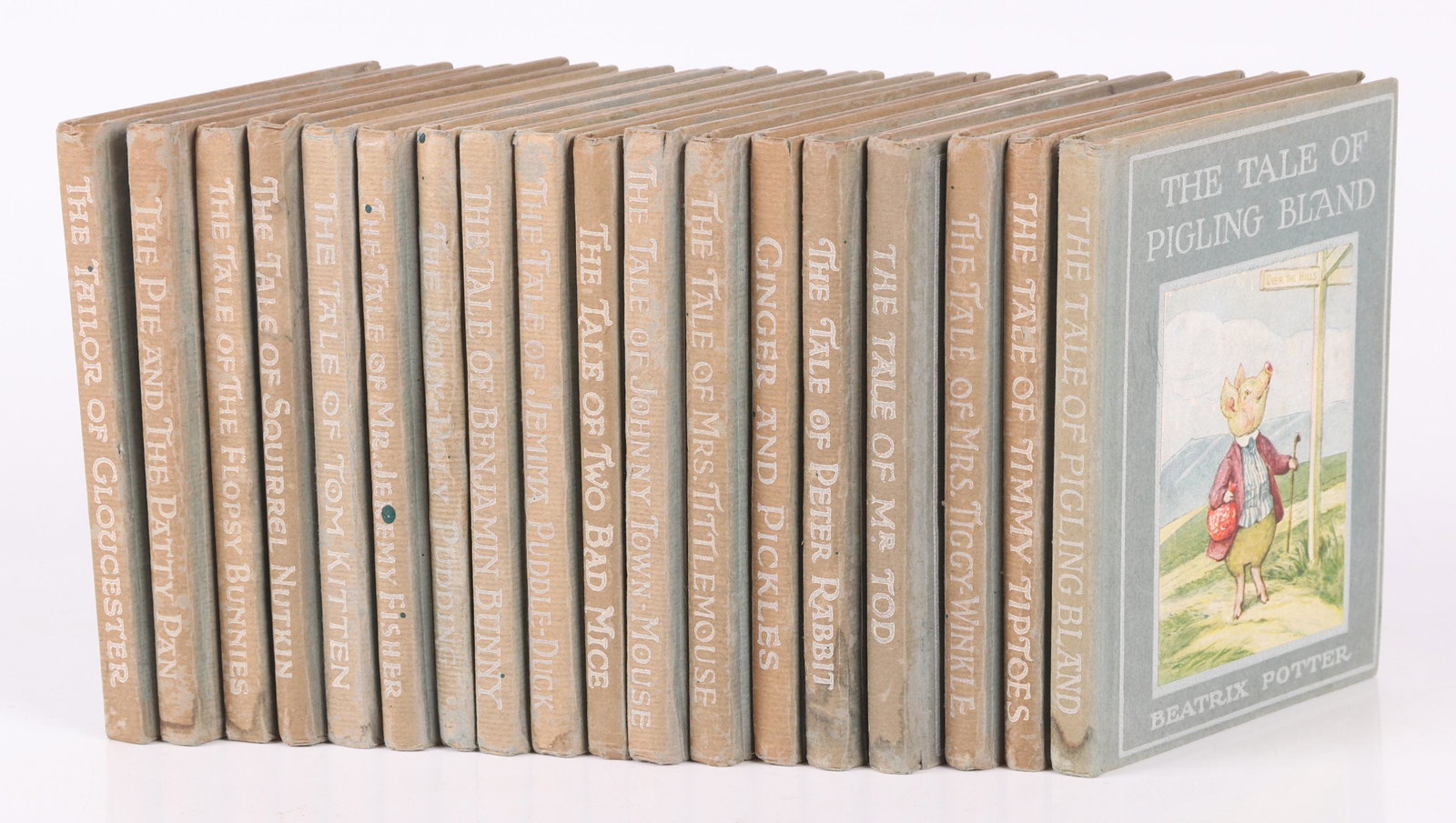 A Group of Books By Beatrix Potter: All in green cloth bindings and published by F. Warne and Co. Comprising: "The Tailor of Gloucester" 1931 printing, "The Pie and the Patty Pan" 1933 printing, "The Tale of the Flopsy Bunnies" 1937 pri