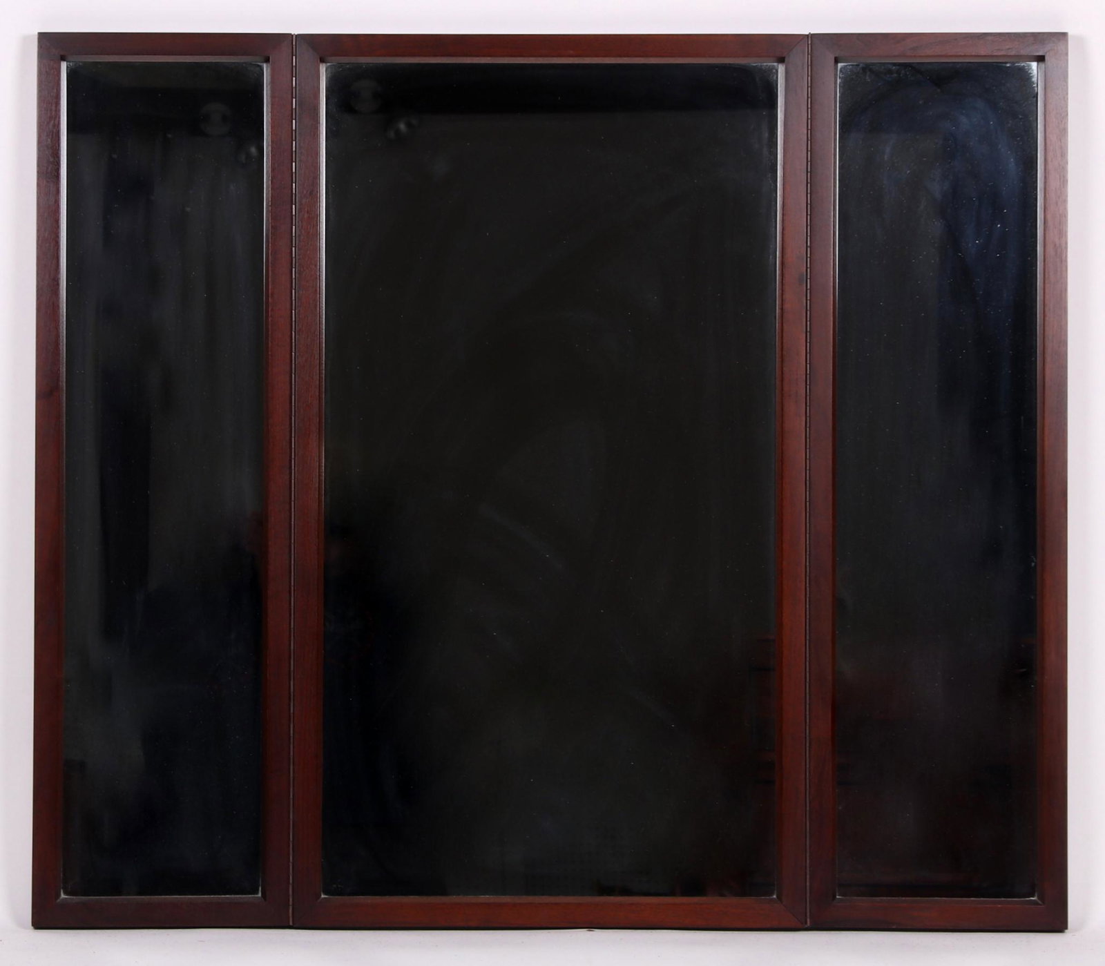 John Stuart For Mt. Airy Furniture, Mirror: Mid 20th century, a three part walnut mirror with hinges that allow for folding. Unmarked. Dimensions: 48" x 42" in the open position. Provenance: From a local collection.