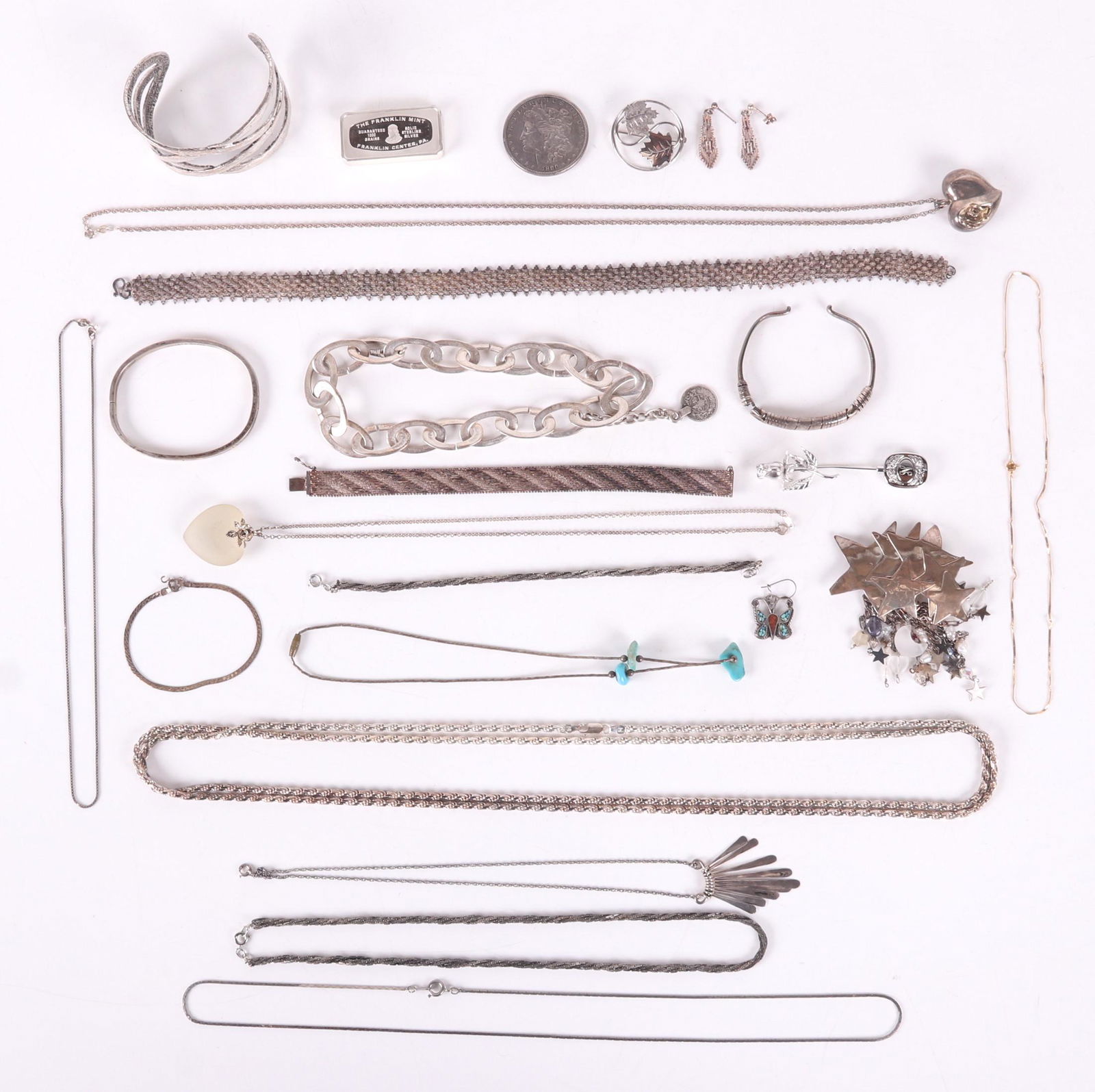 A Group of Silver Jewelry, Etc...: Chains, bracelets, pins, pendants, earrings, a two troy ounce silver bar and an 1890 silver dollar. Dimensions: Various, the total approximate gross weight is 13 troy ounces. Provenance: From a Pennsy