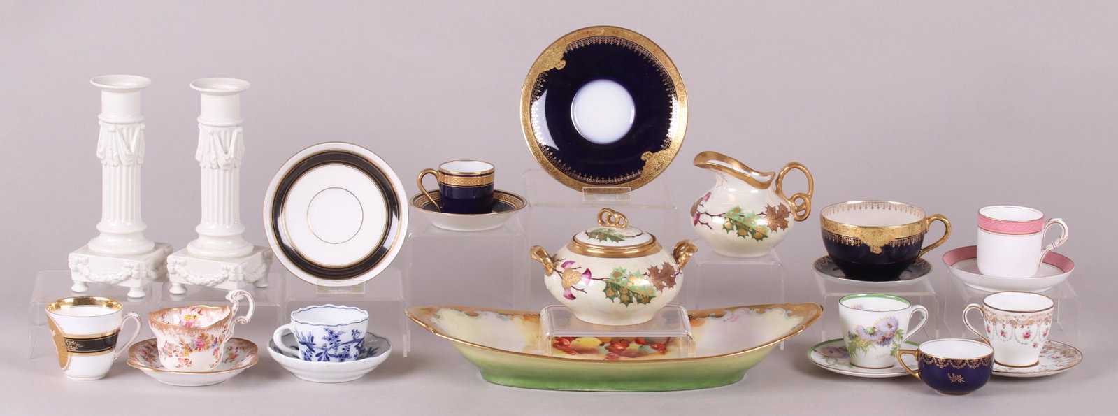 A Group of Porcelain , Demitasse Cups, Etc...: Comprising: a pair of white Nymphenburg candlesticks, seven demitasse cup and saucer sets by Royal Doulton, Royal Worcester, Rosenthal, Hammersley, Meissen, Limoges and an unmarked set with hand paint