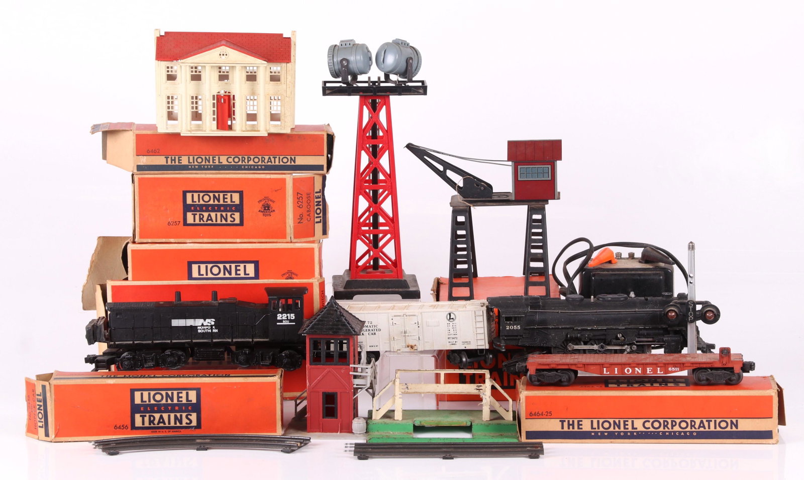A Group of Lionel 027 Trains with Accessories: Comprising: Red Hopper Car # 6456, Gondola Car 3 6462, Caboose # 6257, Tender with Whistle # 6026W, #6511, Great Northern Boxcar # 6464, Tank Car # 6465, a group of trestles, track, three transformers