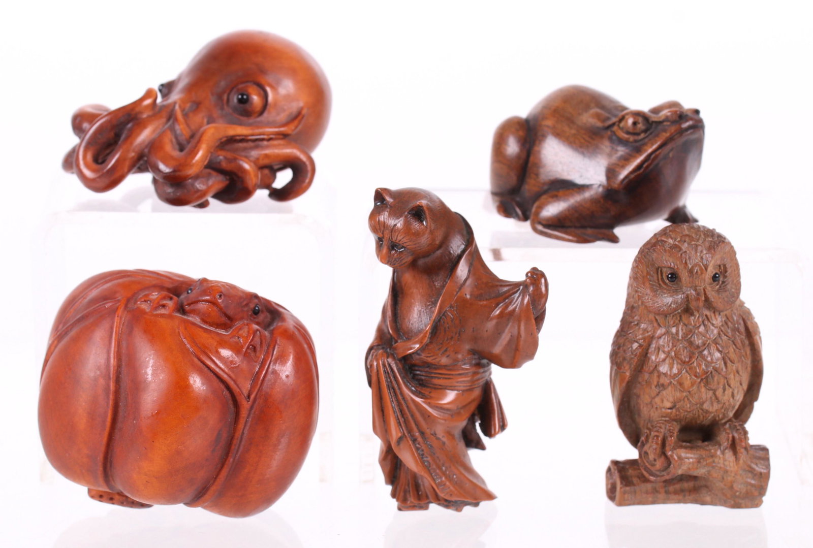 Five Japanese Netsuke, Animals: All appear to be 20th century, an octopus, a frog, a cat, an example with turtles poking their heads out of a gourd and an owl. All are wooden, except for the cat which is resin. Dimensions: From 1" x
