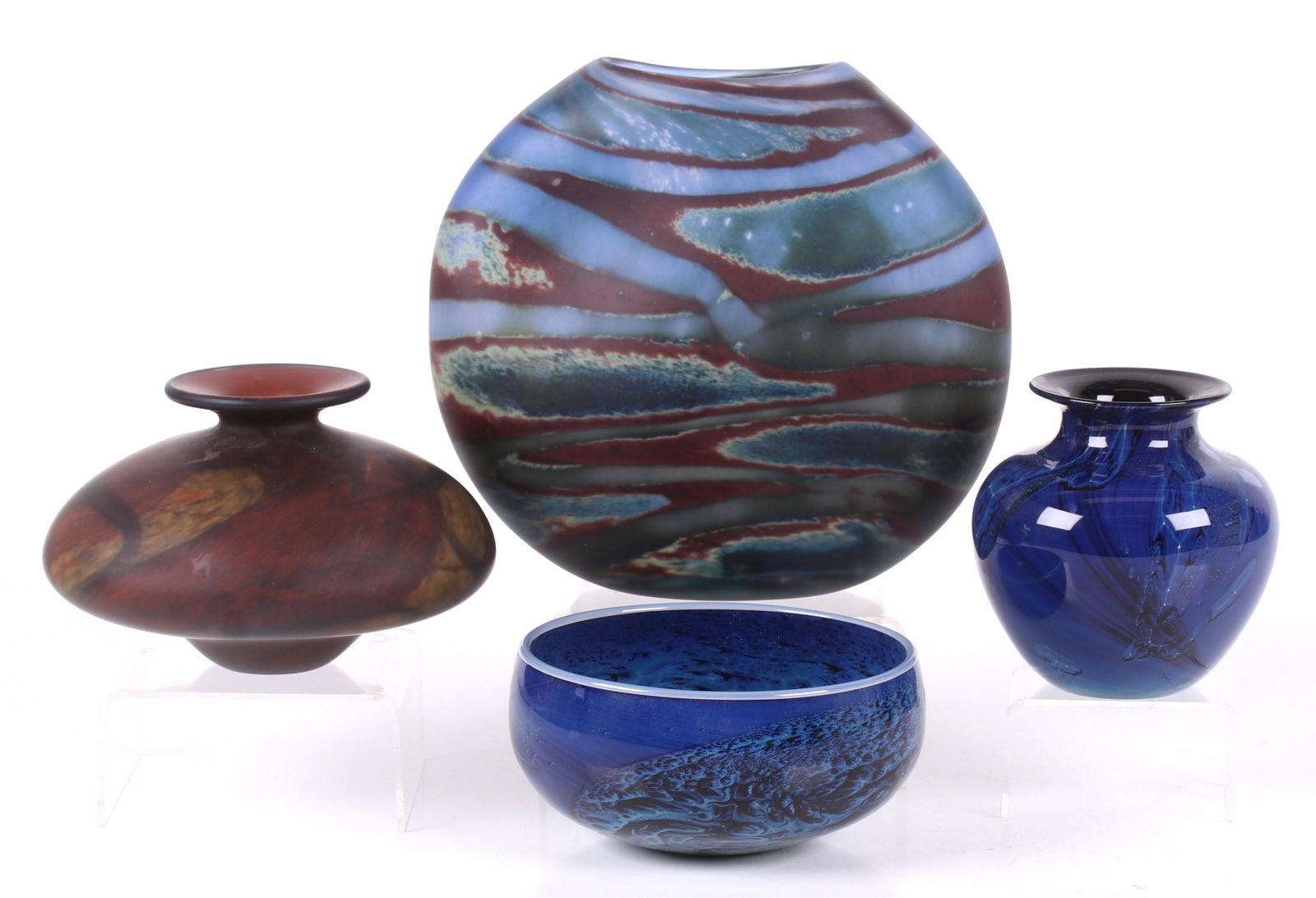 Four Art Glass Vessels Including Josh Simpson: Two examples by Josh Simpson, both signed, one dated for 1998 and the other for 2004, a squat brown mottled vase that is illegibly signed and an unsigned pillow form vase. Dimensions: From 4" in diame