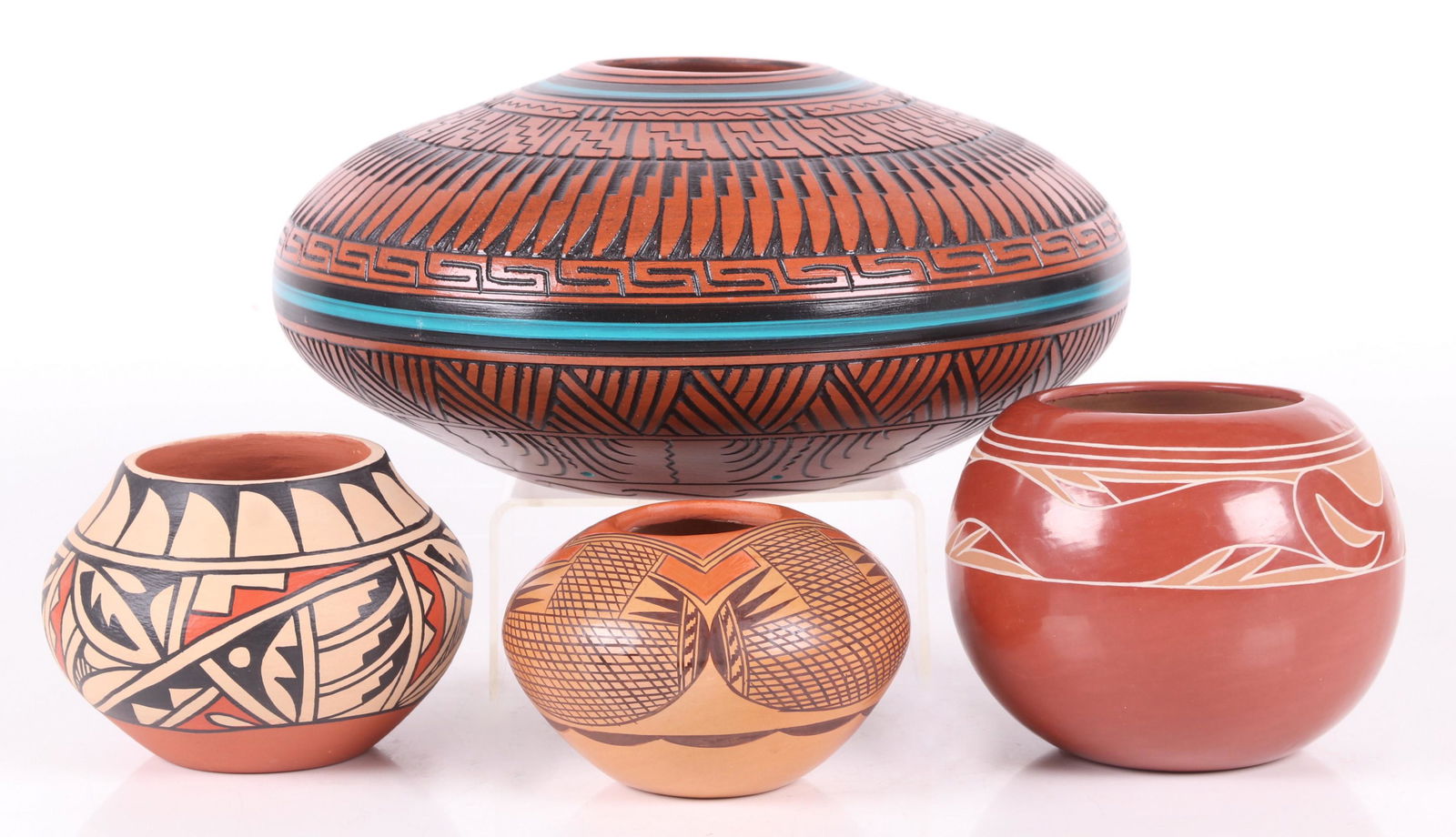 Four Pieces of Modern Southwest Pottery: A Earlene Youngbird Tafoya redware vase, a Jemez Pueblo example by Dorela Tosa, a Hopi bowl by Adelle Nampeyo, and a Navajo example by Dewayne & Heather Eskeet. Dimensions: From 4 1/2" to 10 1/2" in d