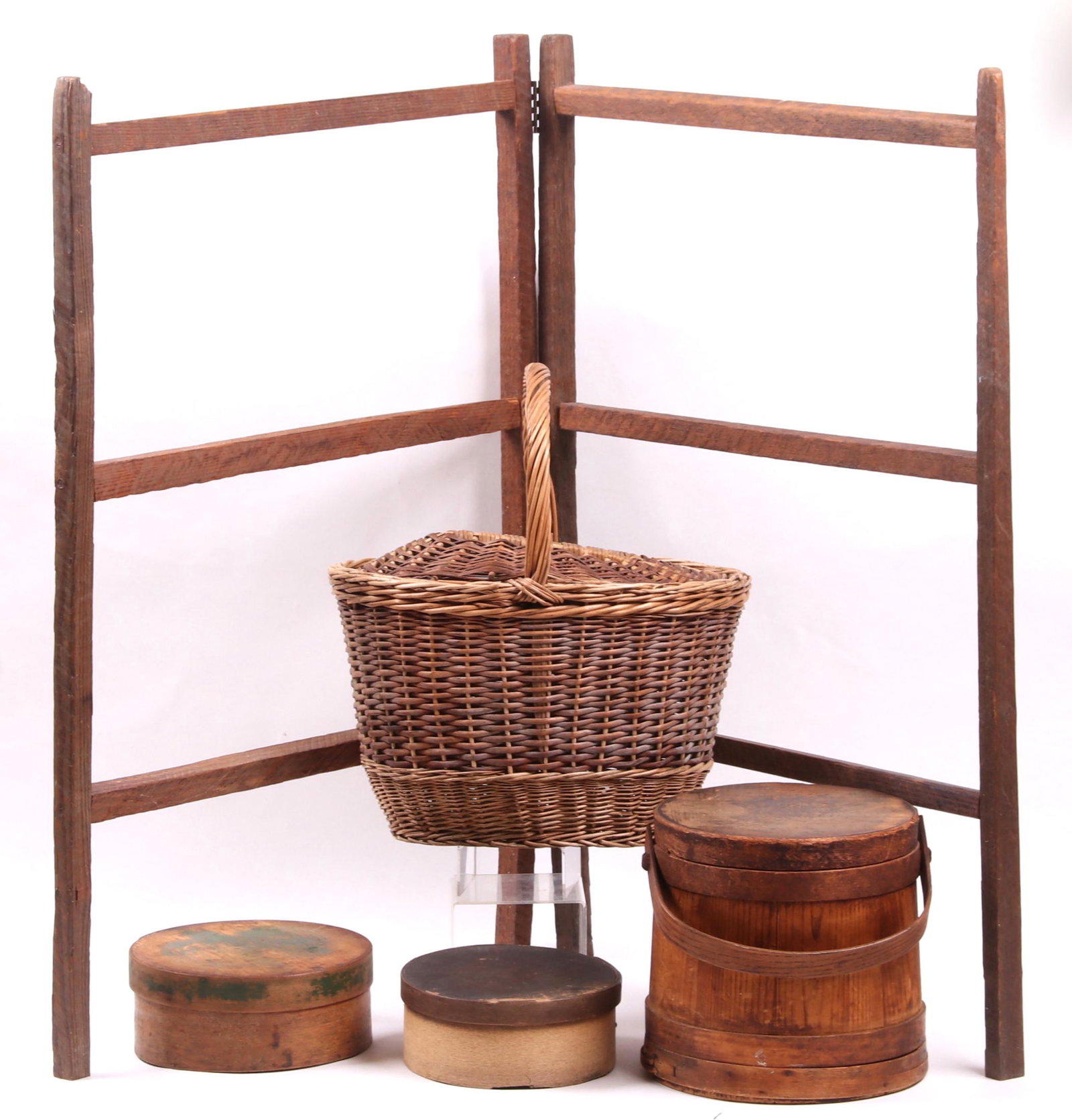 Americana, Firkin, Pantry Boxes, Basket: All late 19th century, a firkin with bail handle and lid, two pantry boxes with nailed construction, a wooden quilt rack and a market basket with handle and lid. Dimensions: From 8" in diameter to 16 