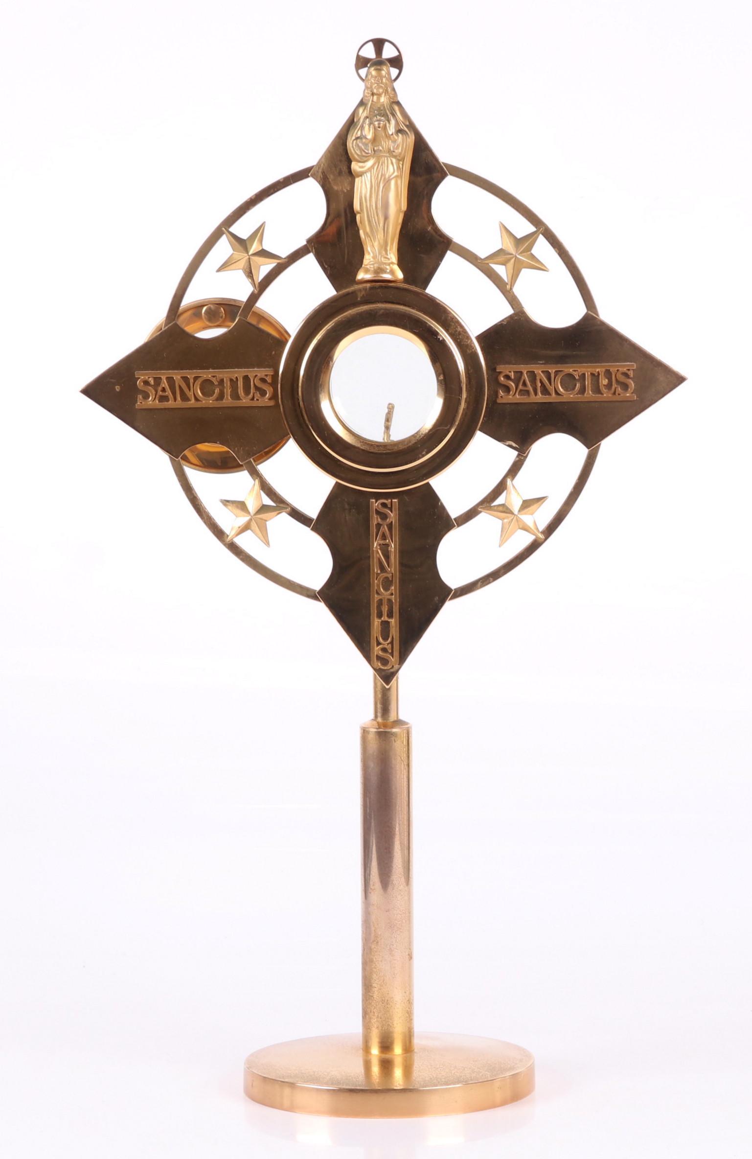 A Large Gilt Metal Monstrance: 20th century, with a circular foot, cylindrical shaft and cross form body with star decoration and Jesus figure at the crest. The luna is gilt sterling. Dimensions: 14" x 7", the height is 24 1/2".